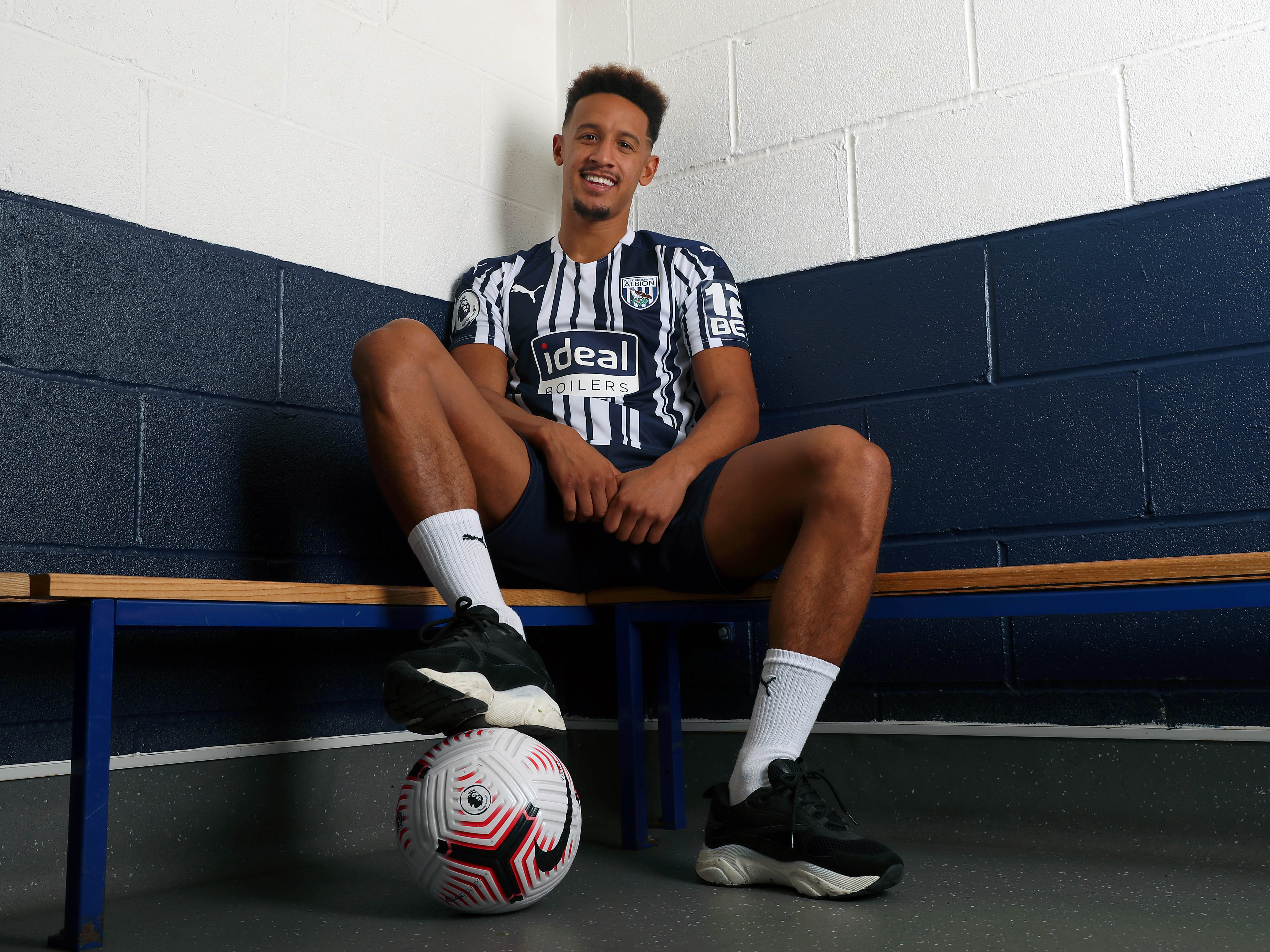 Callum Robinson poses for pictures after joining the Baggies permanently