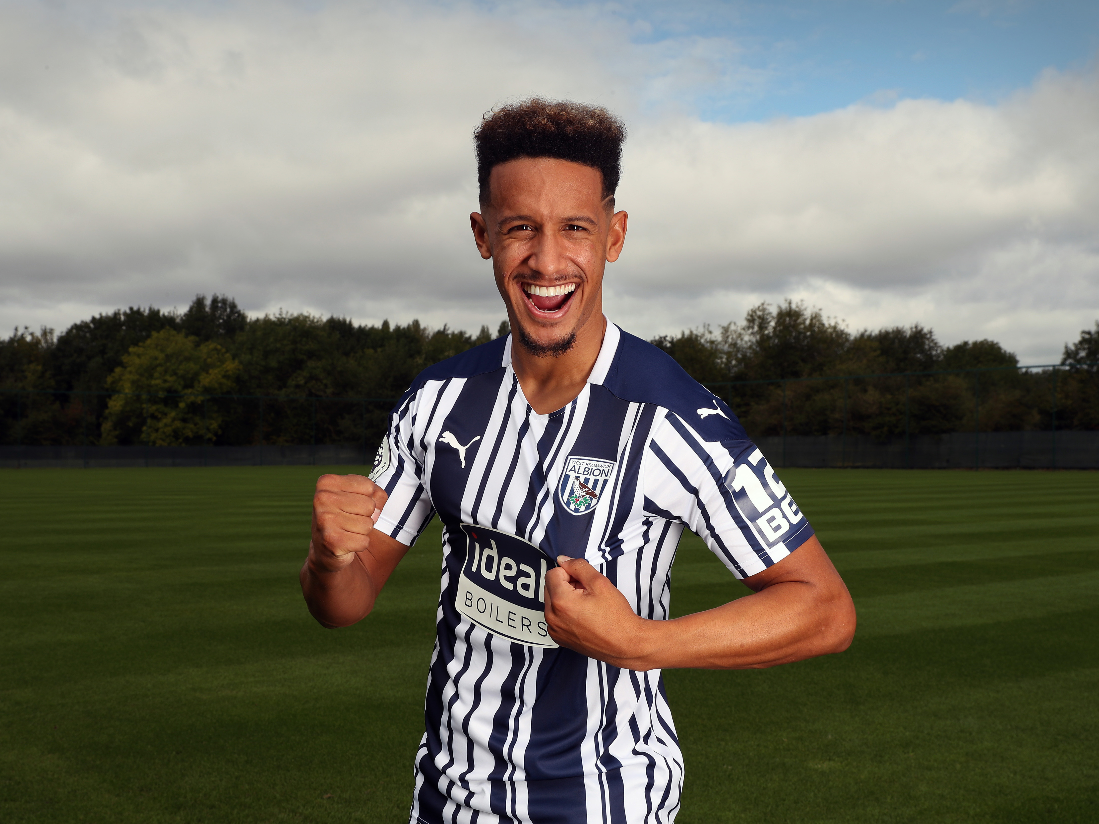 Callum Robinson poses for pictures after joining the Baggies permanently