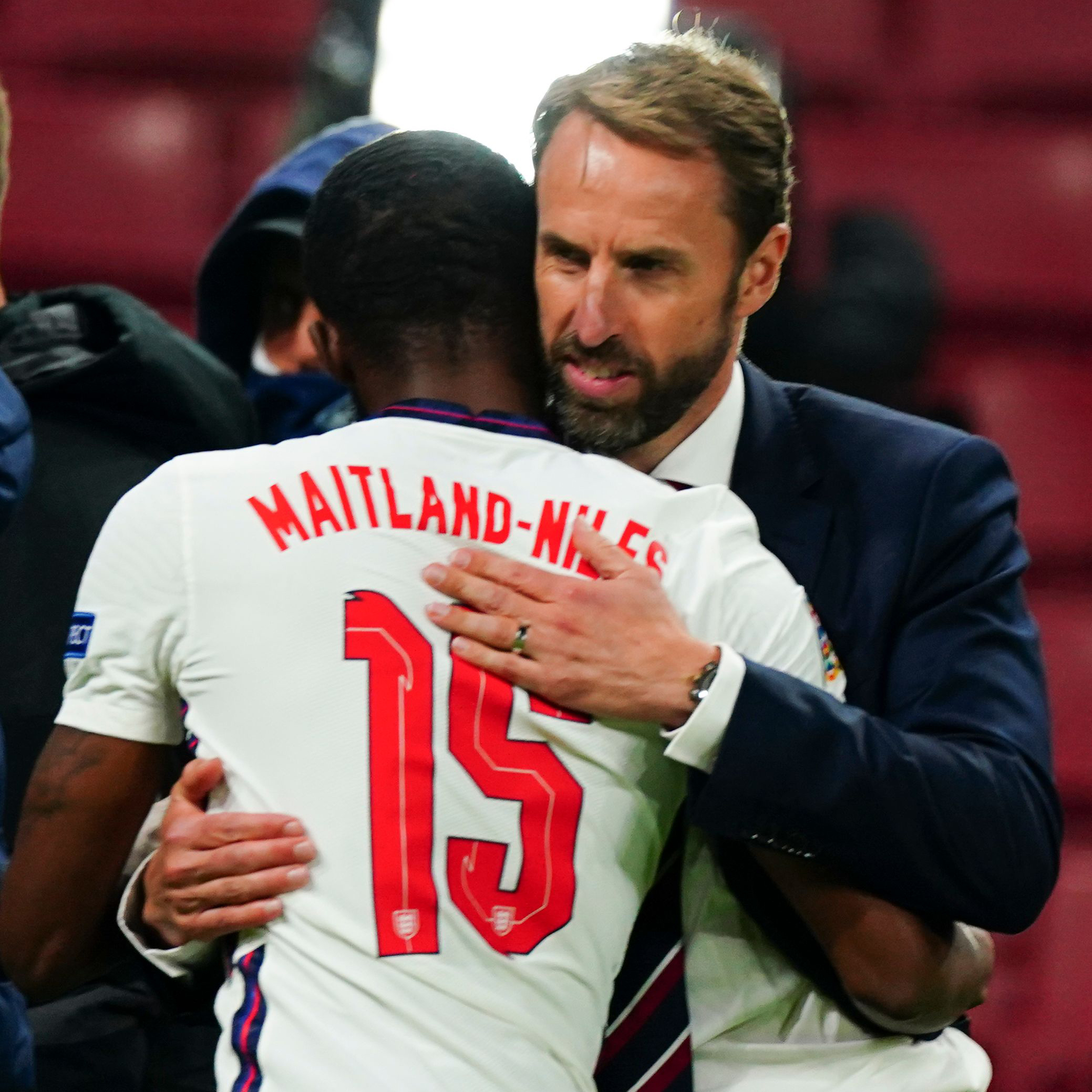 Ainsley Maitland-Niles hugs England manager Gareth Southgate