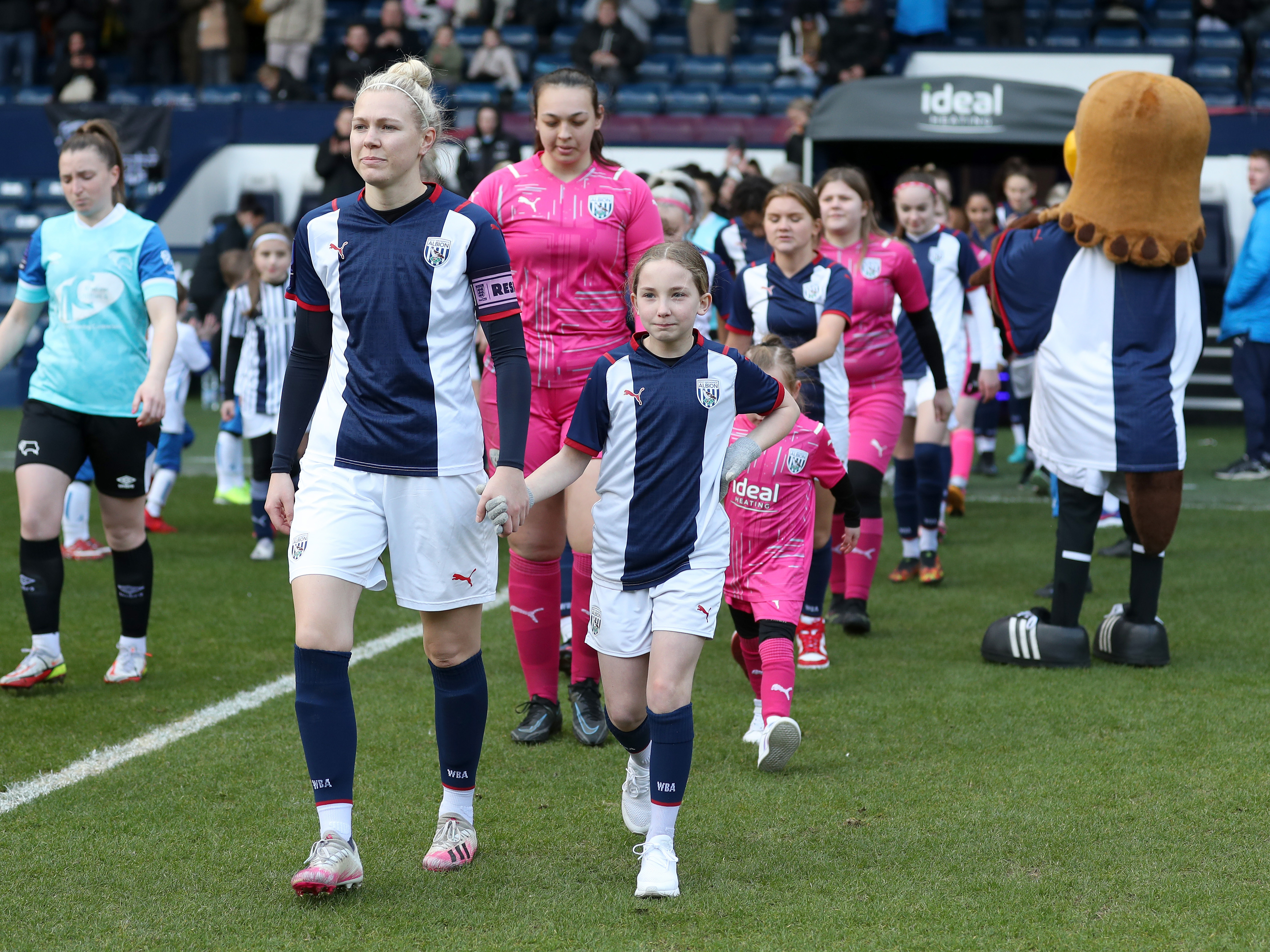 Albion Women walk out of the Hawthorns tunnel with mascots