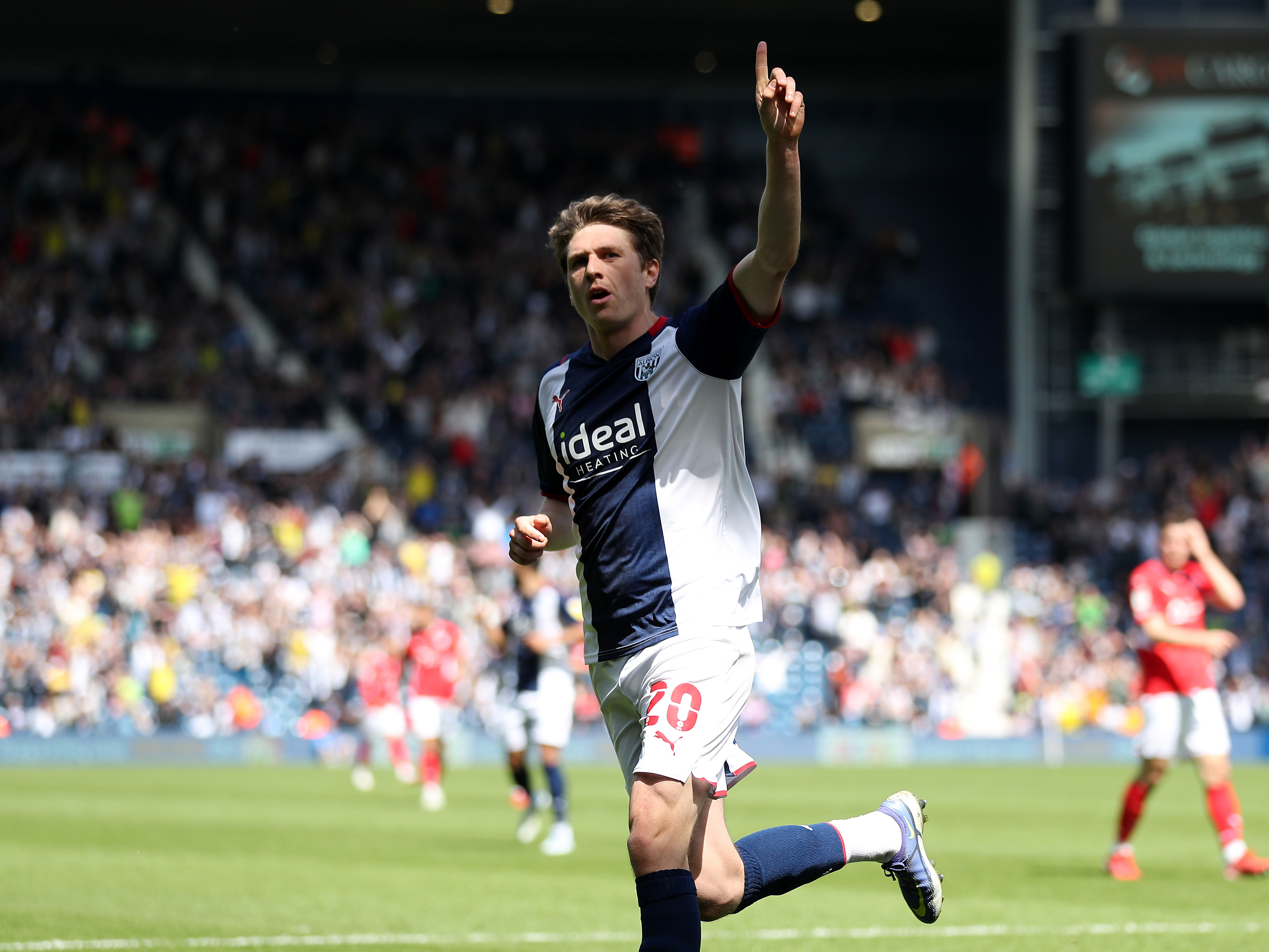 Adam Reach celebrates his goal against Barnsley