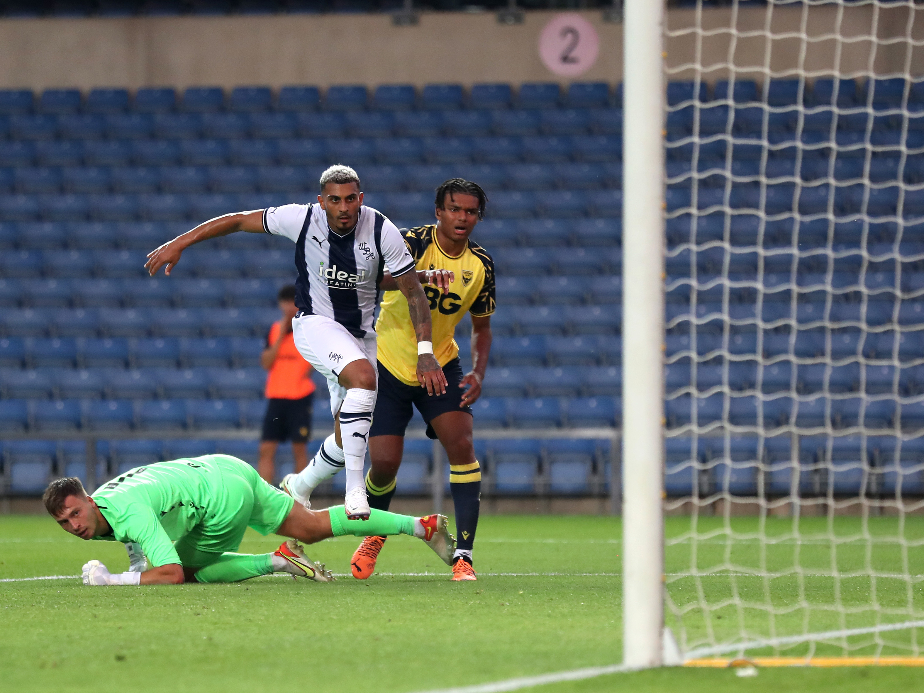 Karlan Grant scores during Albion's friendly against Oxford United
