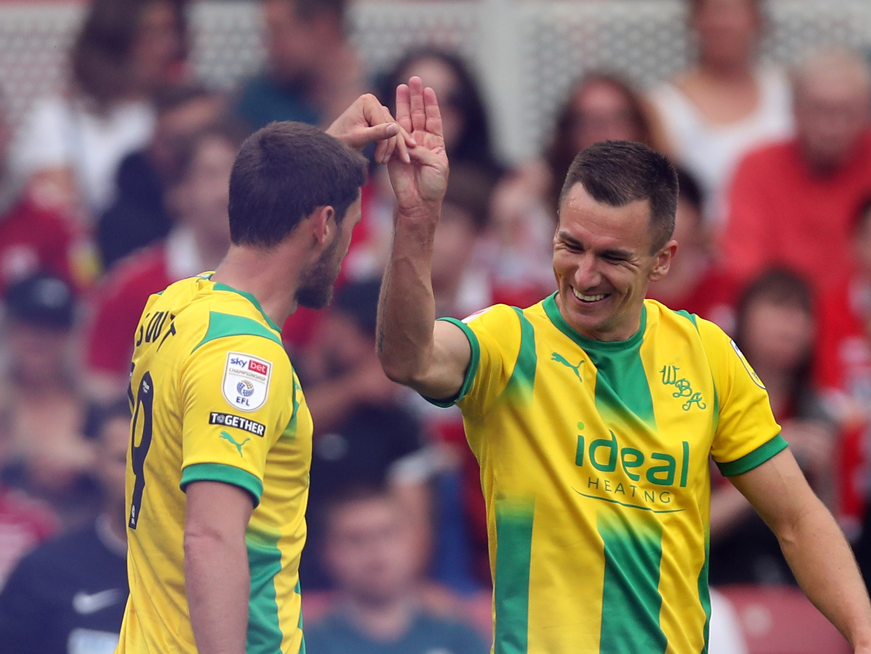 Swift and Wallace celebrate Albion's goal at Middlesbrough