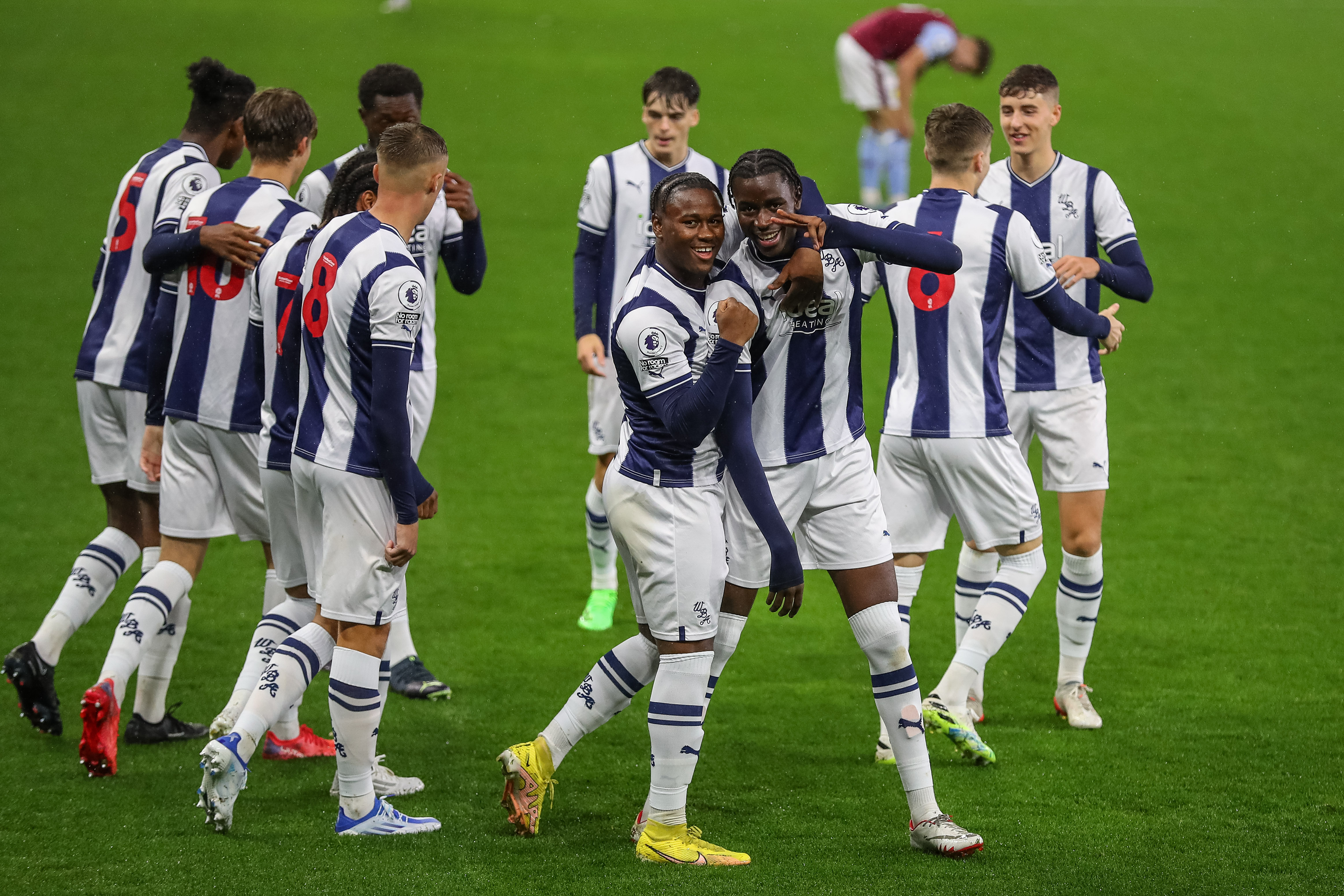 Albion's PL2 side celebrate at Villa Park after the first goal of the game.