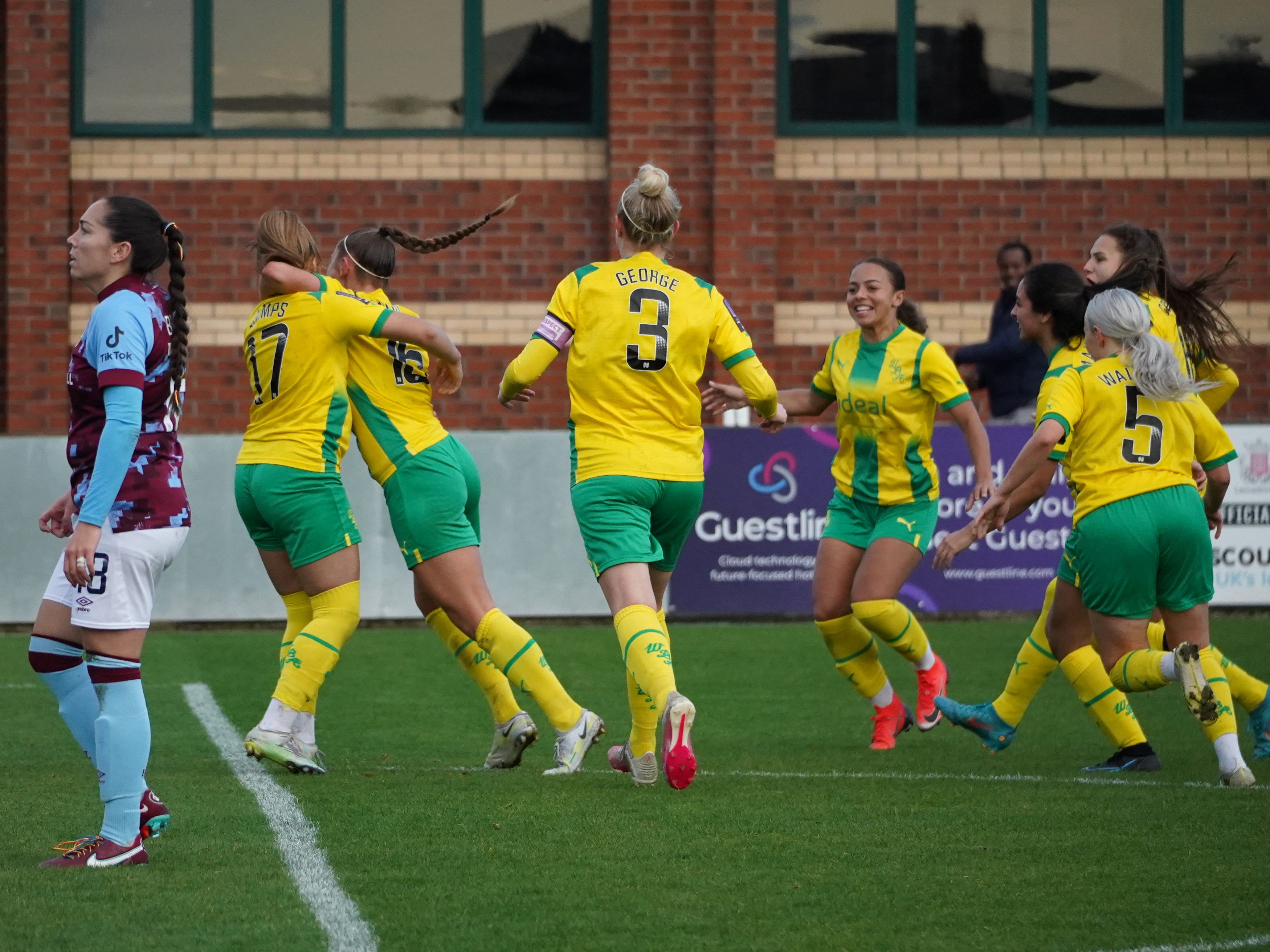 An image of Albion Women celebrating their late equaliser against Burnley