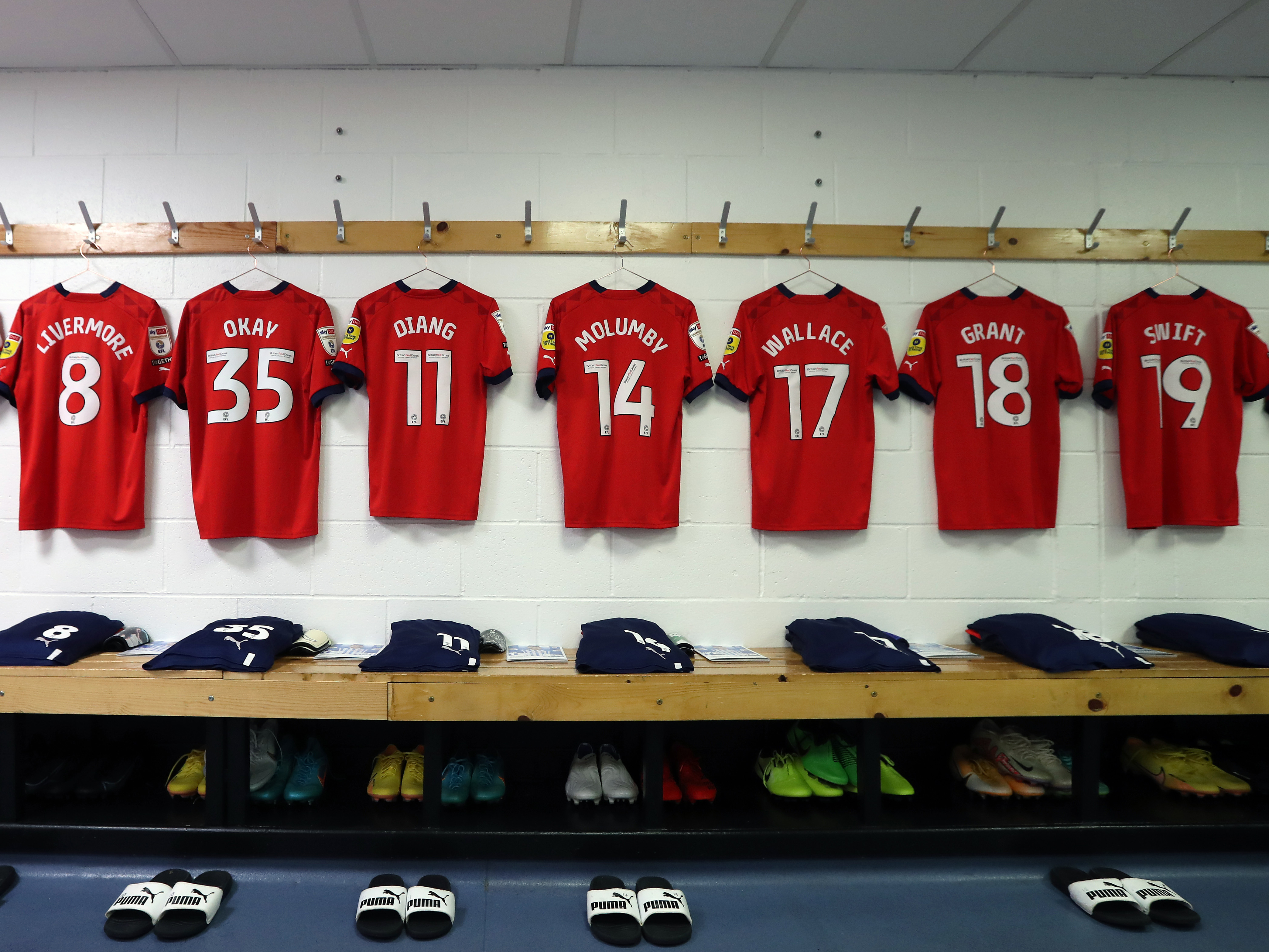 Albion's red shirts hang up in the dressing room at Huddersfield Town