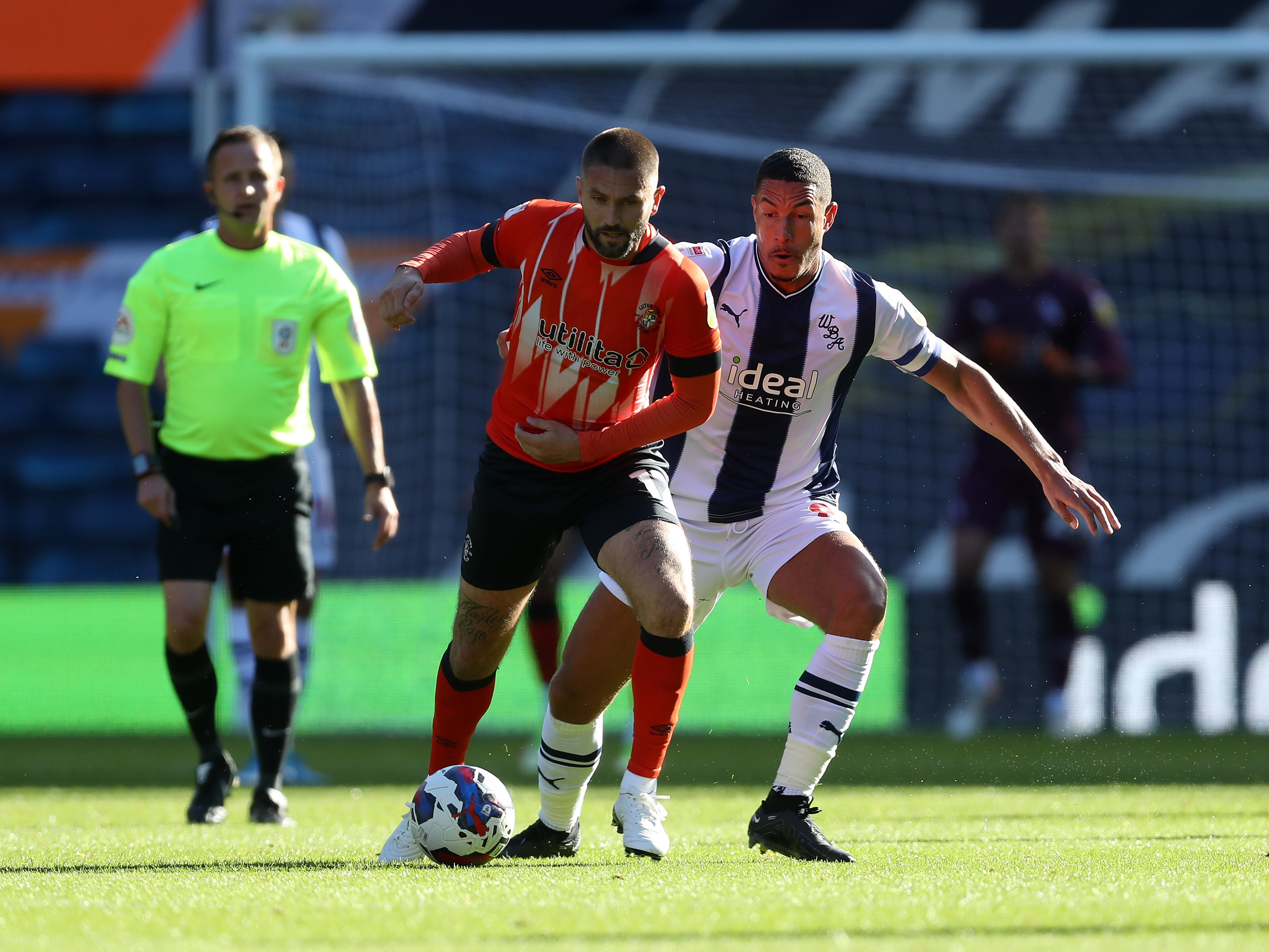 An image of Jake Livermore in action against Luton Town