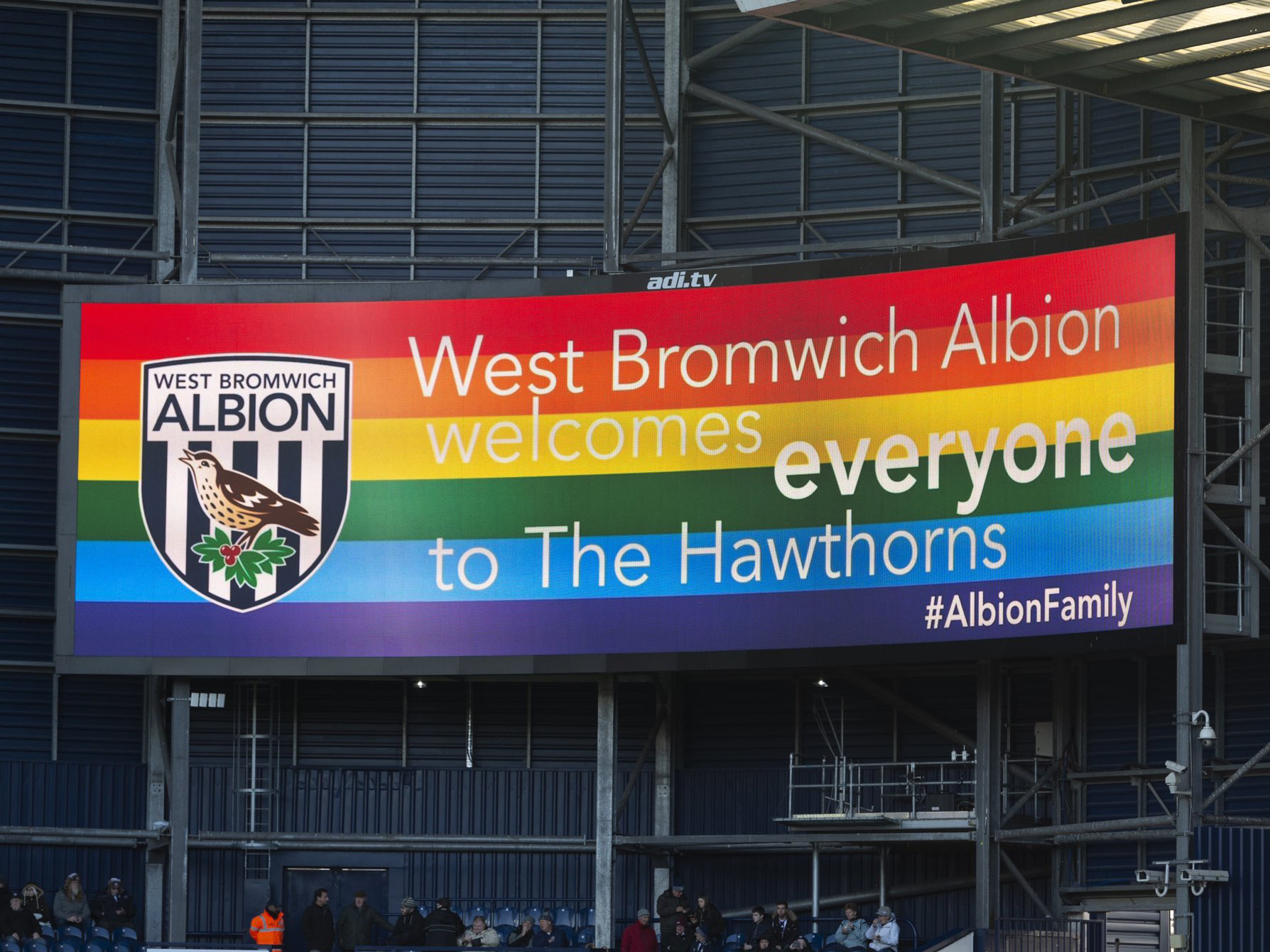 An image of the big screens at The Hawthorns displaying a rainbow flag and the message 'West Bromwich Albion is for everyone'