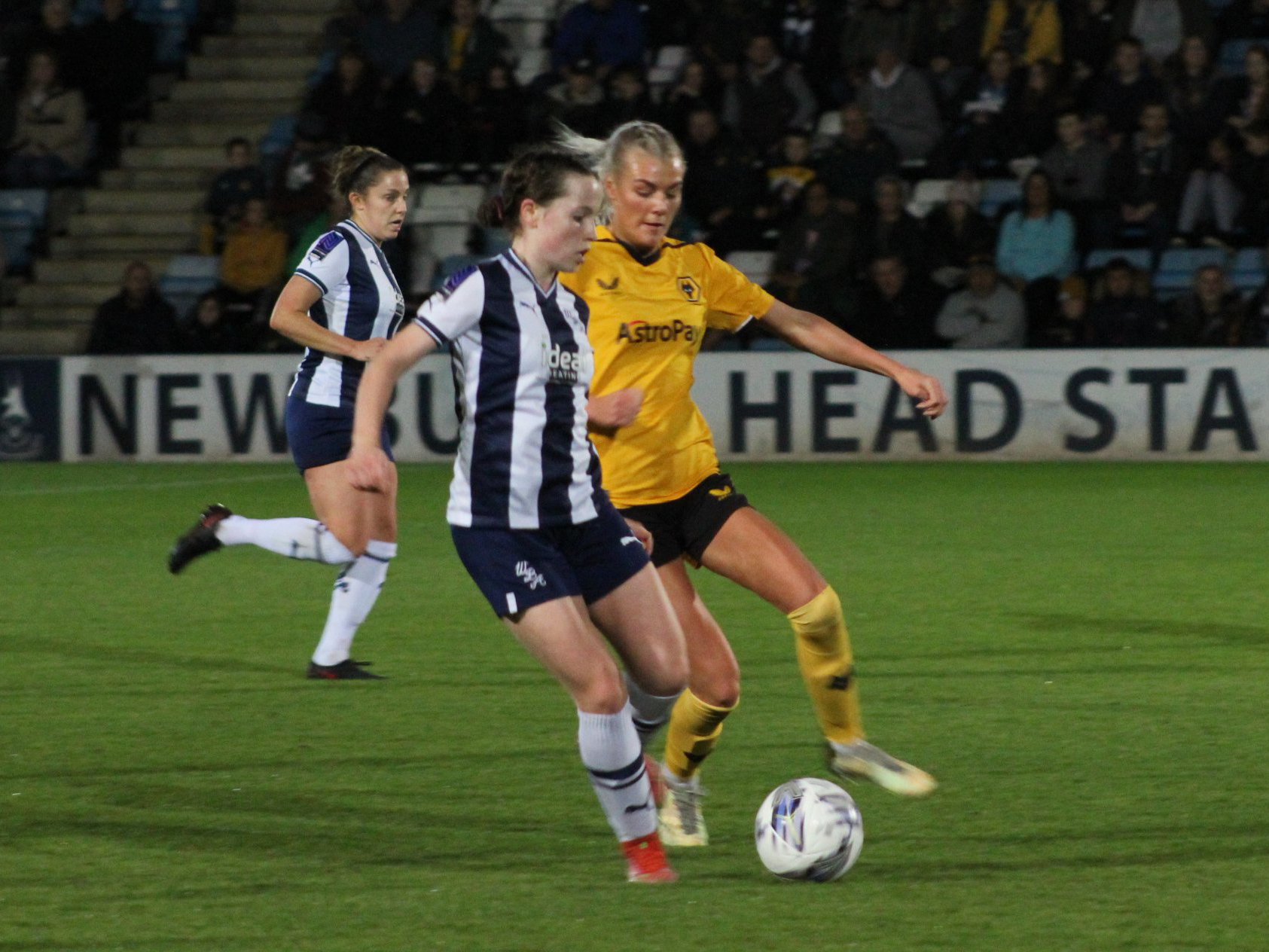 An image of Albion Women player Abi Loydon on the ball against Wolves