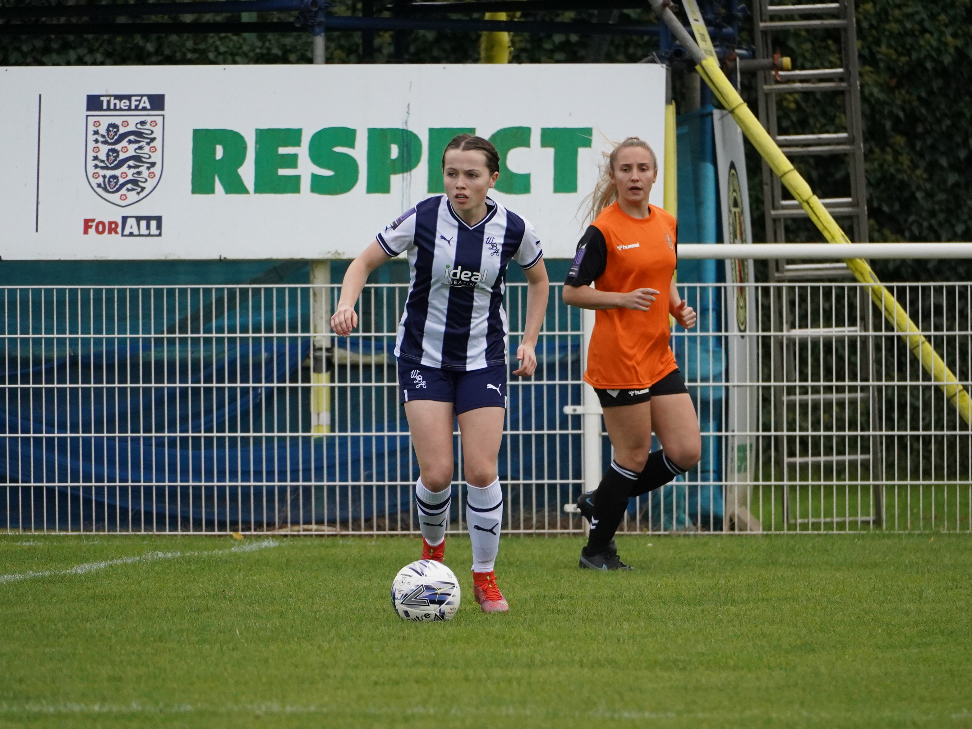 An image of Albion Women's player Abi Loydon on the ball during a match