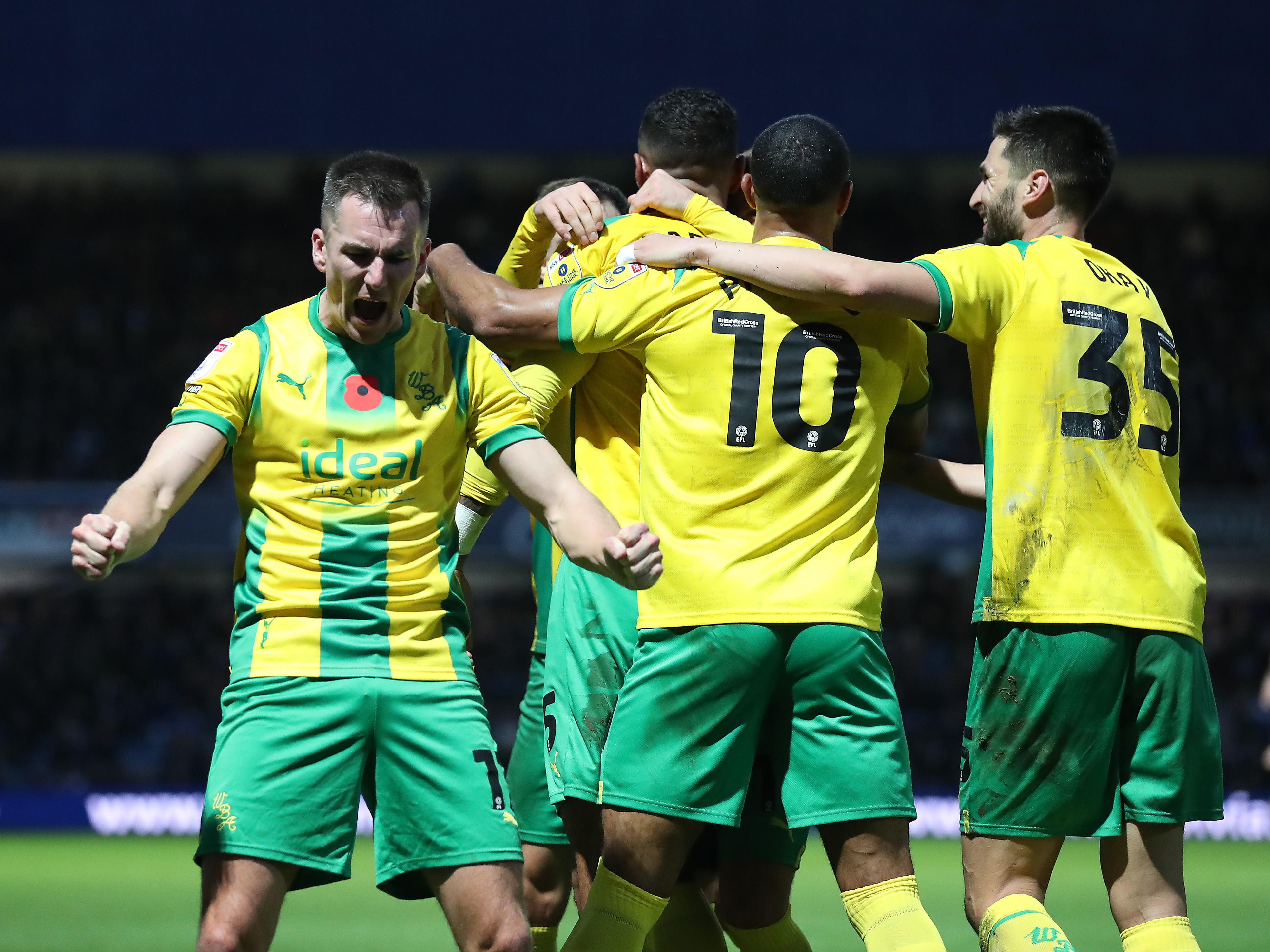 Albion players celebrate Kyle Bartley's goal at QPR