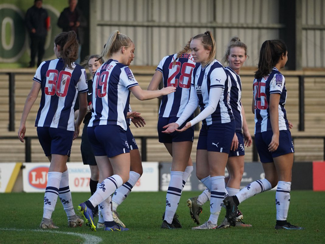 An image of the Albion Women squad celebrating a goal against Crewe