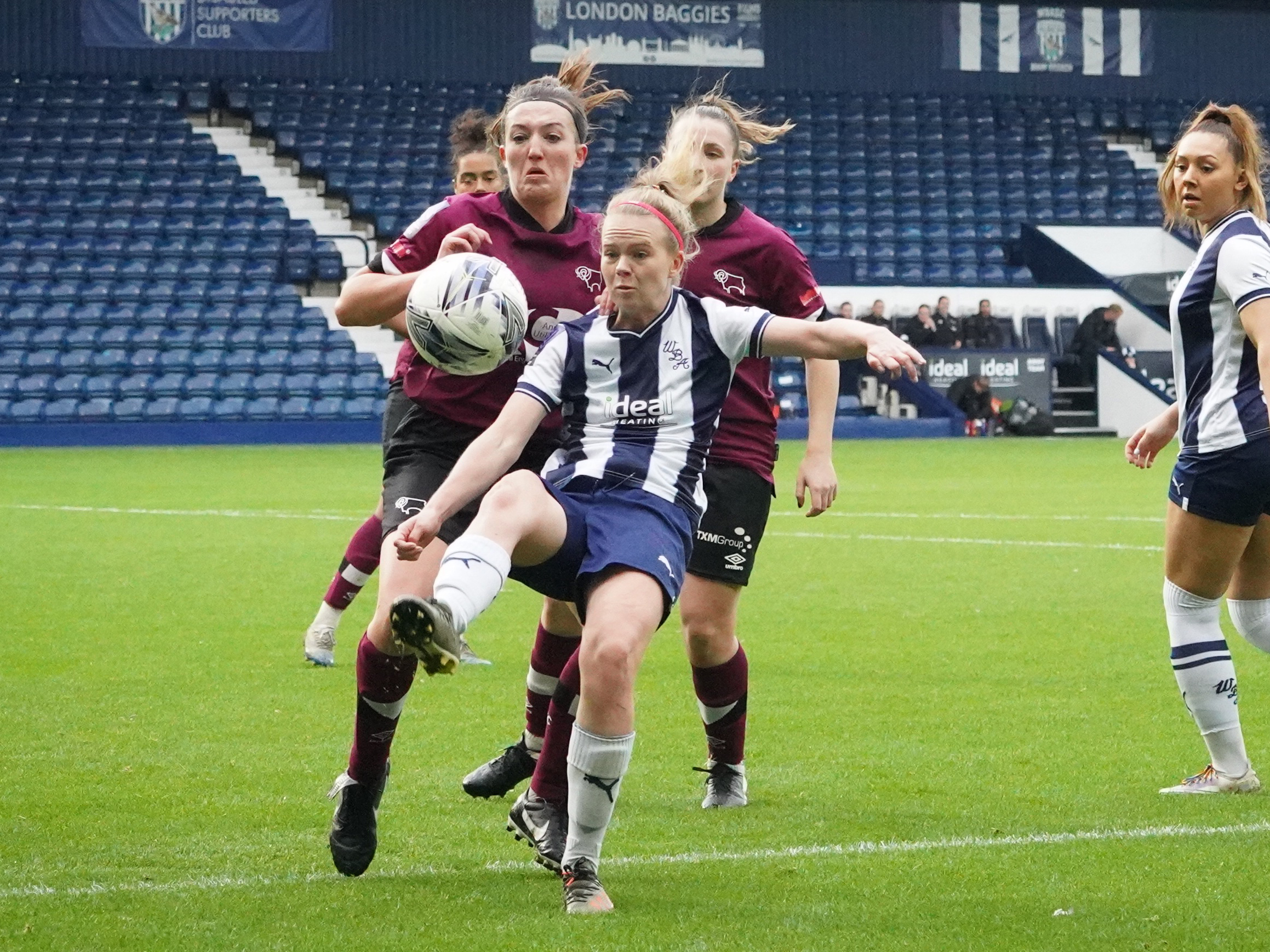 An image of Phoebe Warner in action for Albion Women against Derby County Ladies at The Hawthorns