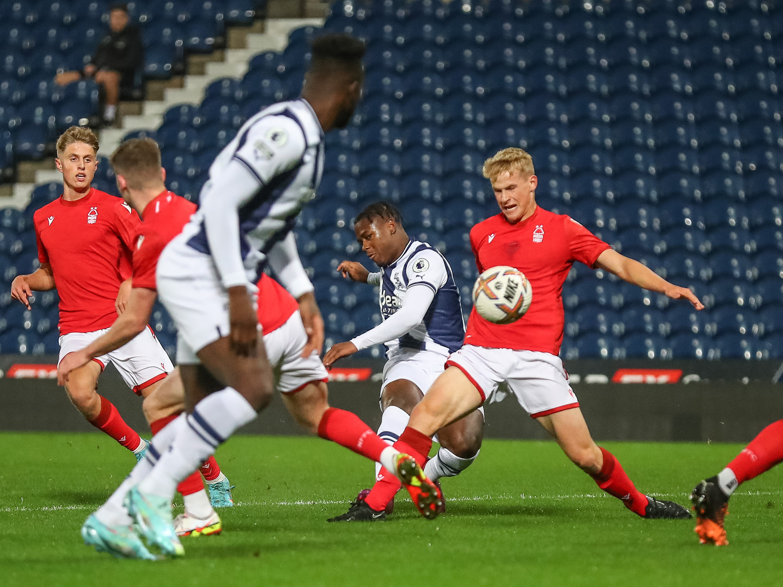 An image of Reyes Cleary attempting a curling shot against Nottingham Forest's Under-21s