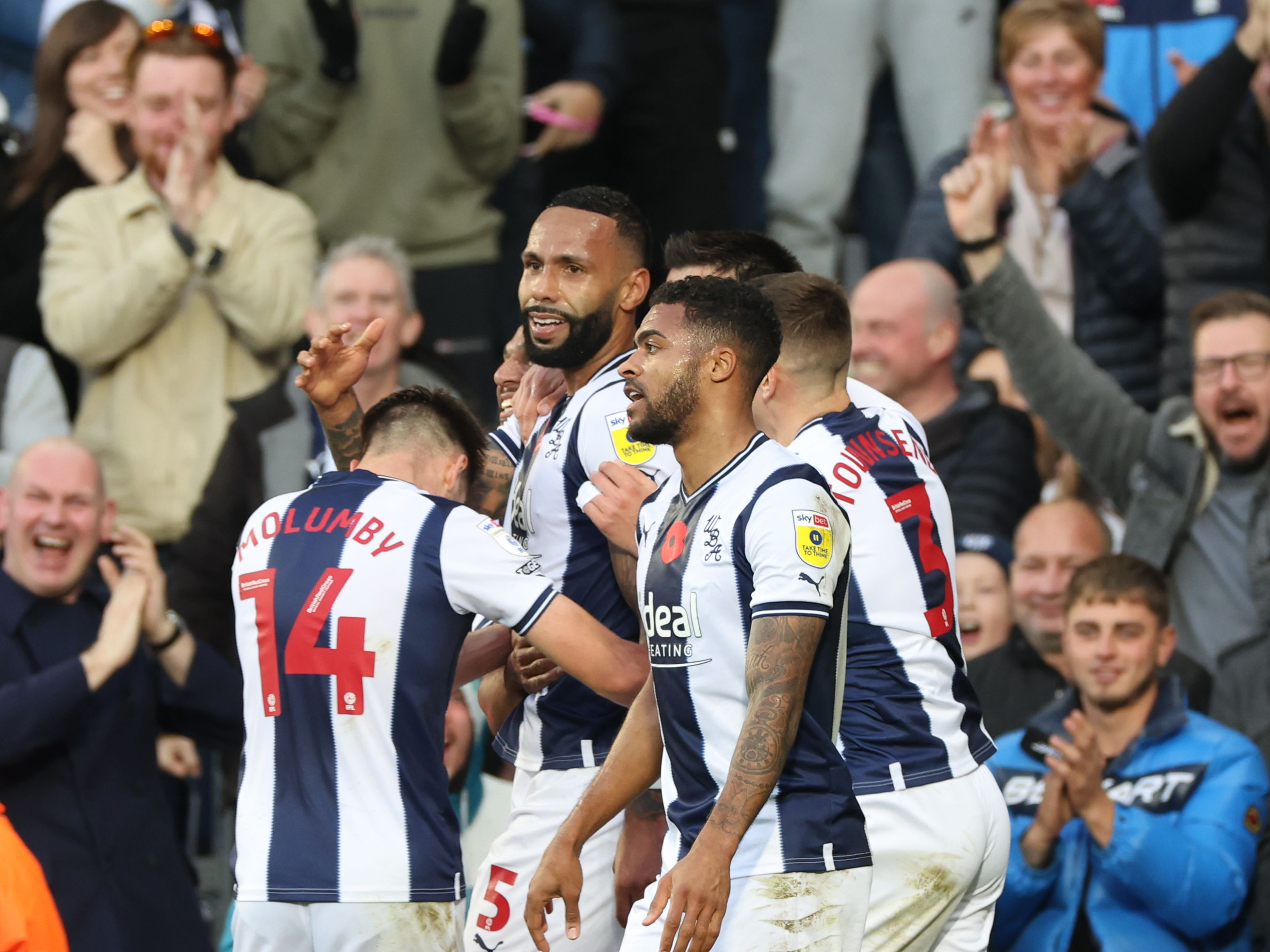 Kyle Bartley celebrates with his teammates against Stoke