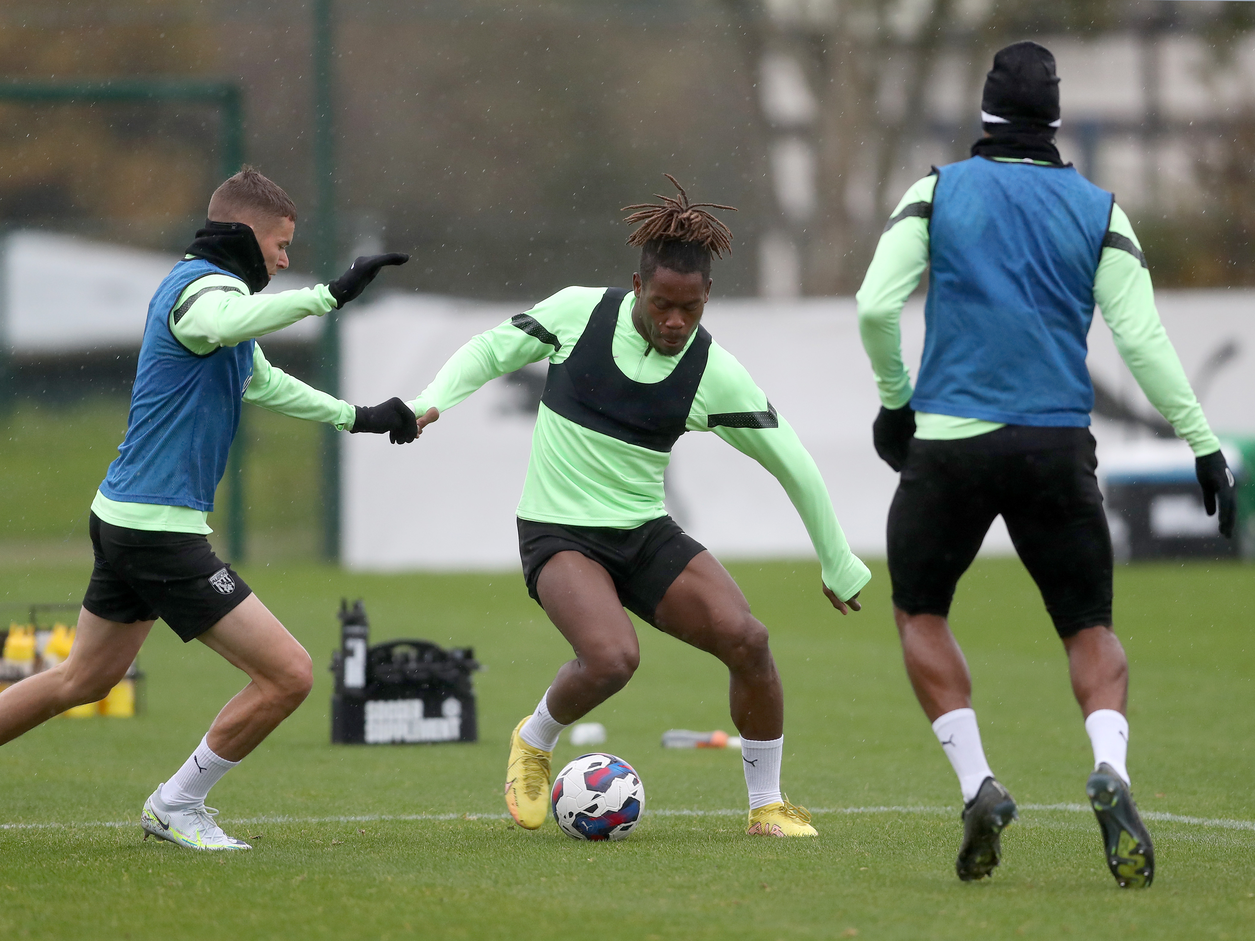 Albion players Brandon Thomas-Asante, Conor Townsend and Matty Phillips challenge for the ball at the club's training ground during the World Cup break
