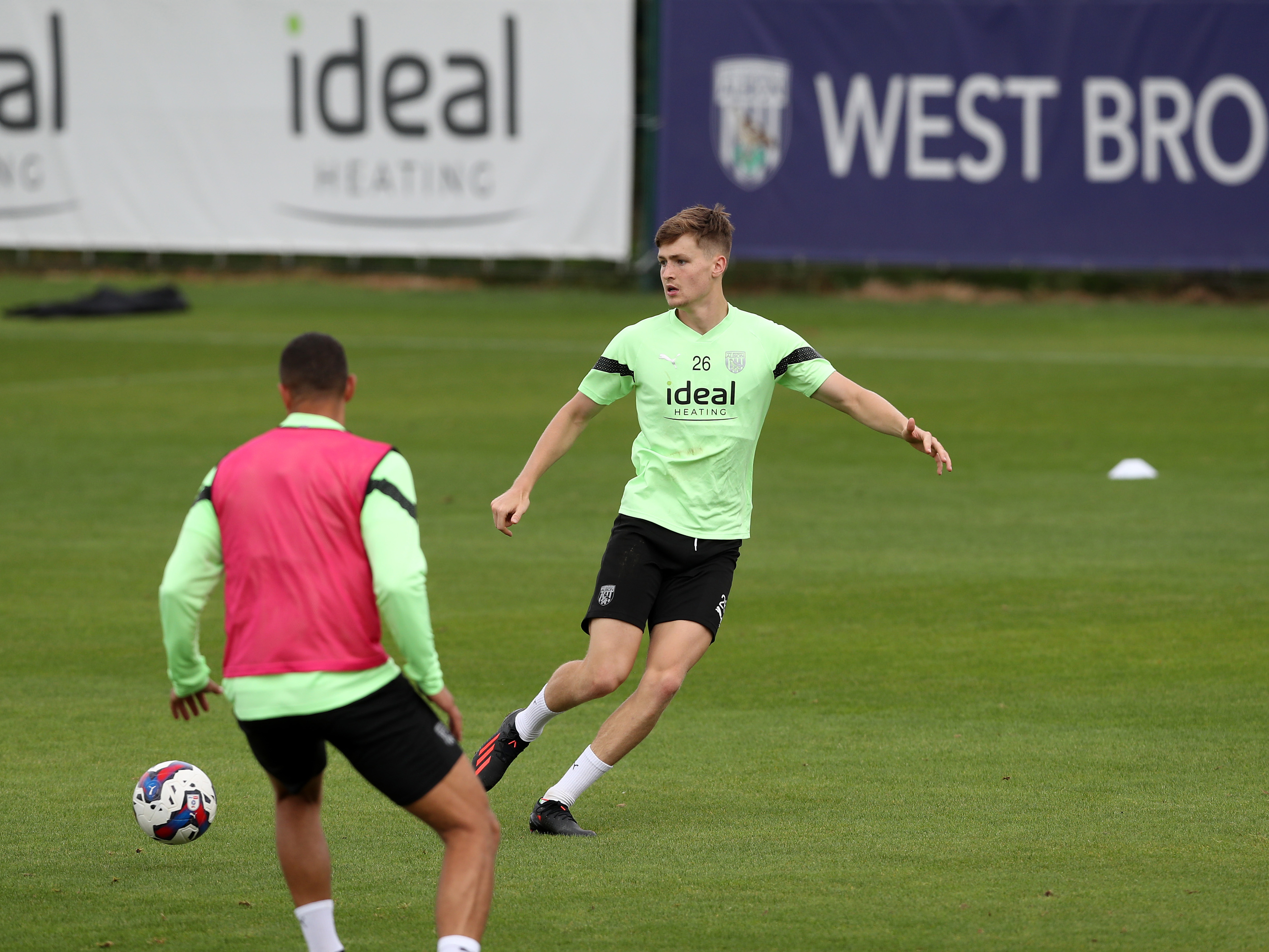 Zac Ashworth passing the ball during first team training