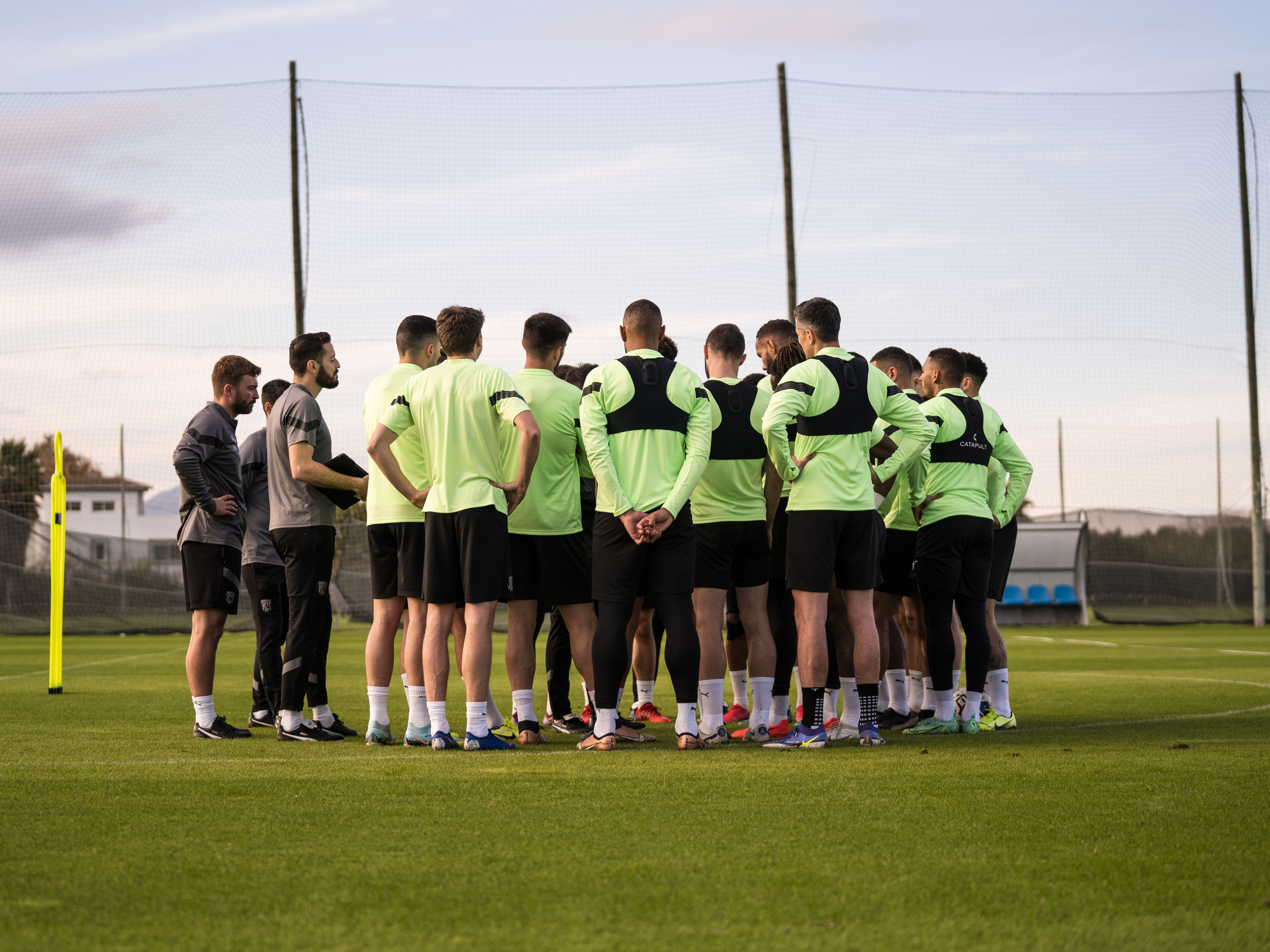 Albion players in a huddle on the training pitch