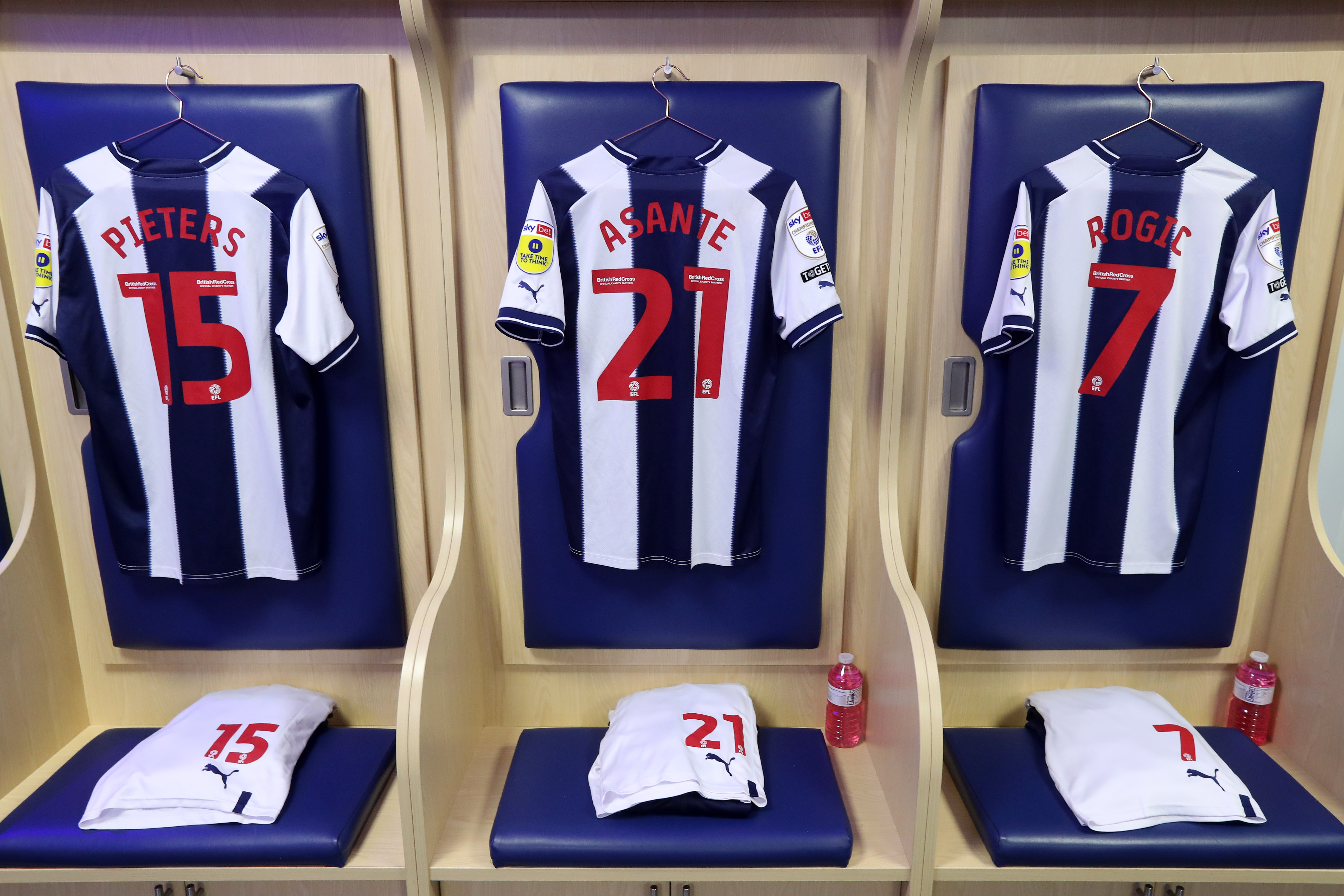 Albion shirts hang up in the home dressing room