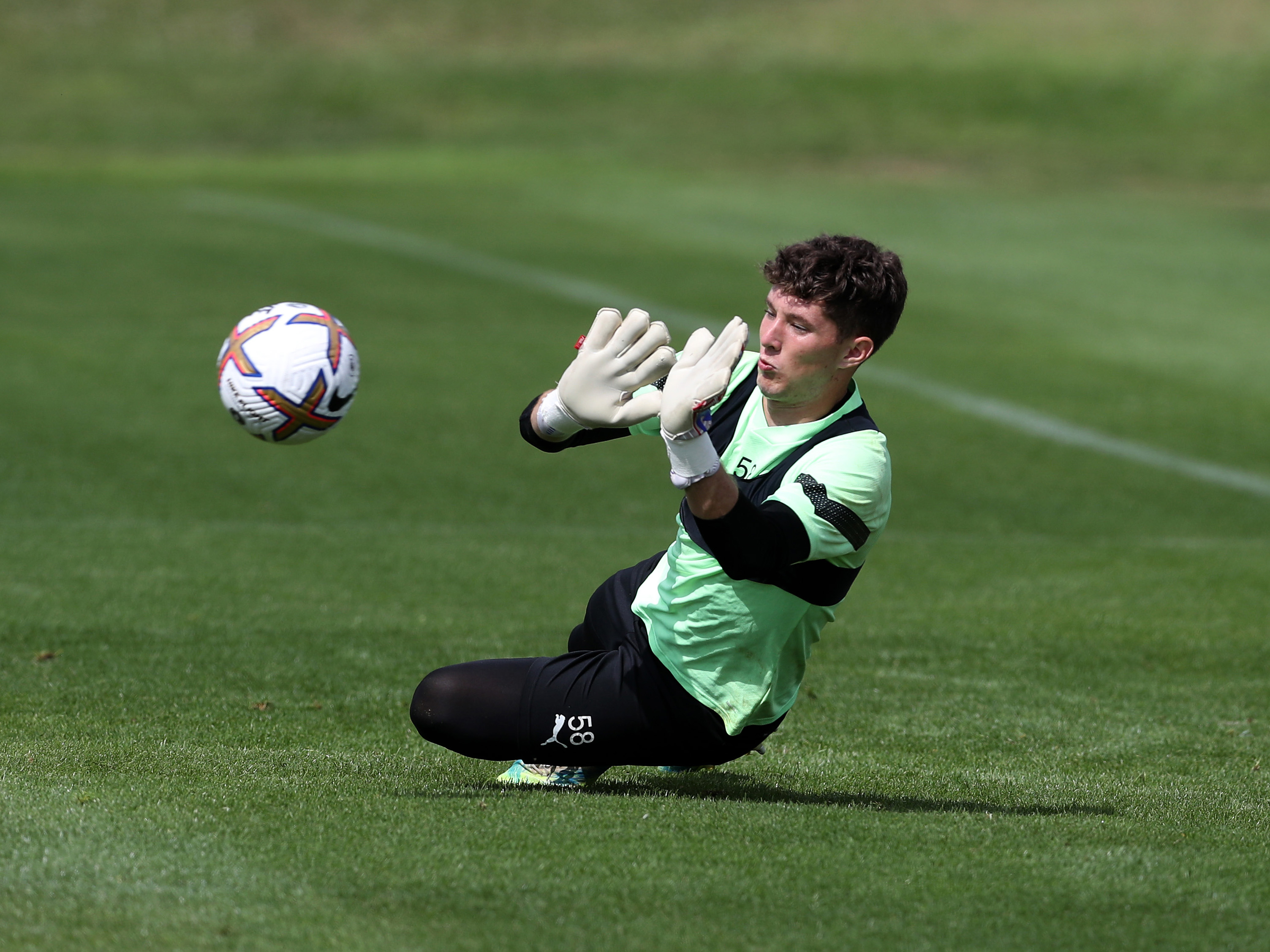 Ronnie Hollingshead saves a shot in training with the U21s