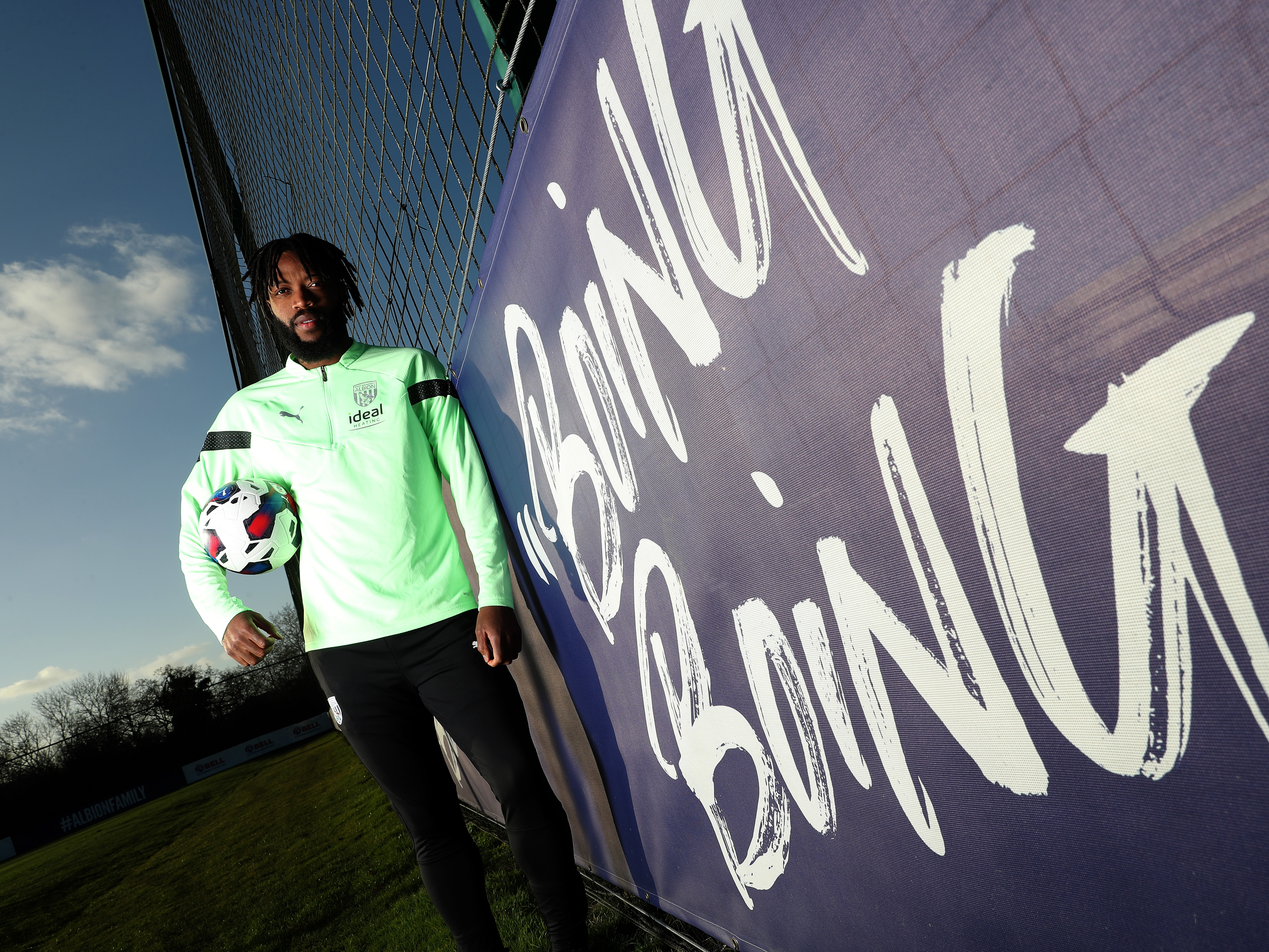 Nathaniel Chalobah standing by a sign which says 'Boing Boing'