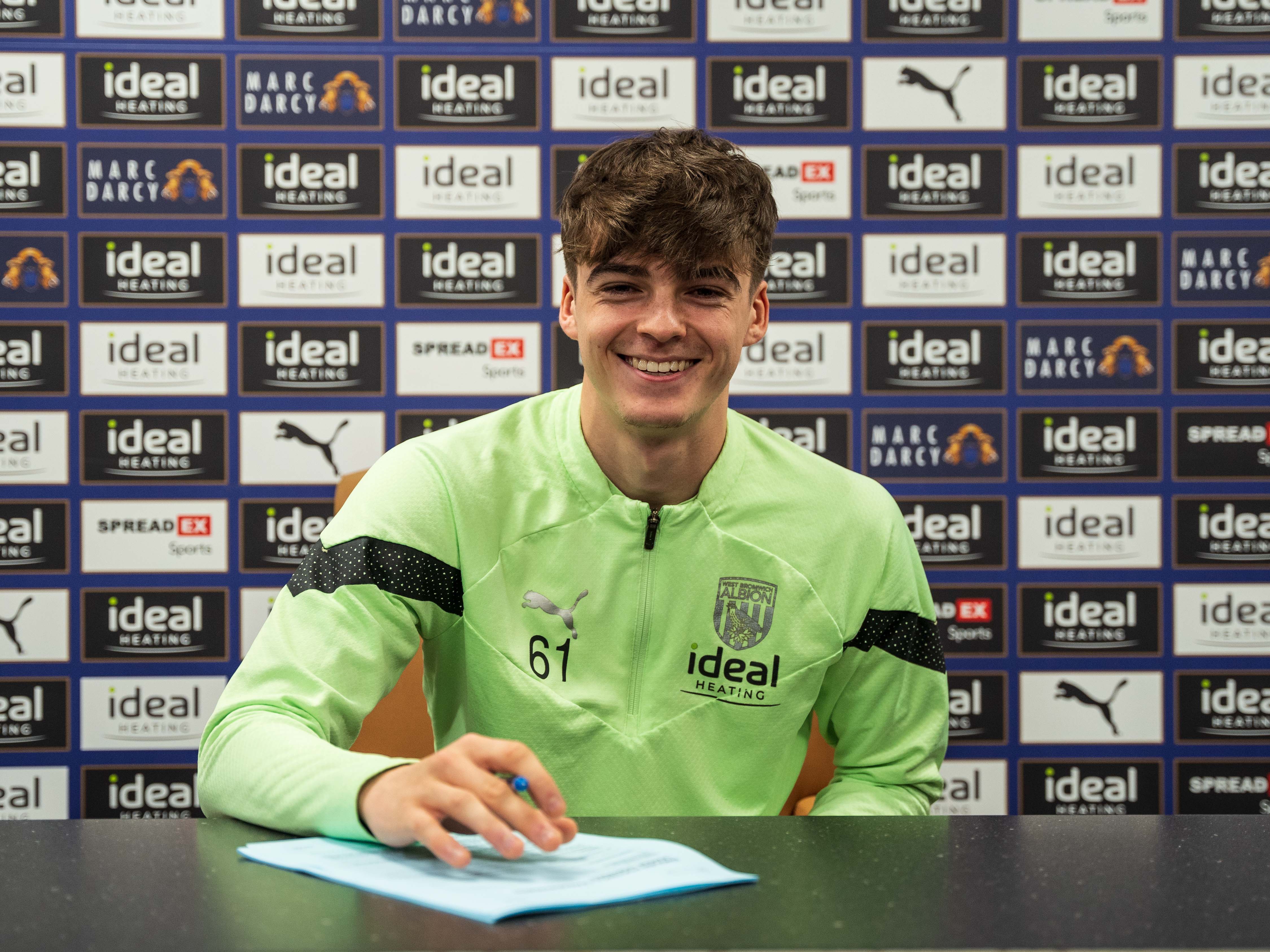Alex Williams signing his first professional contract with Albion