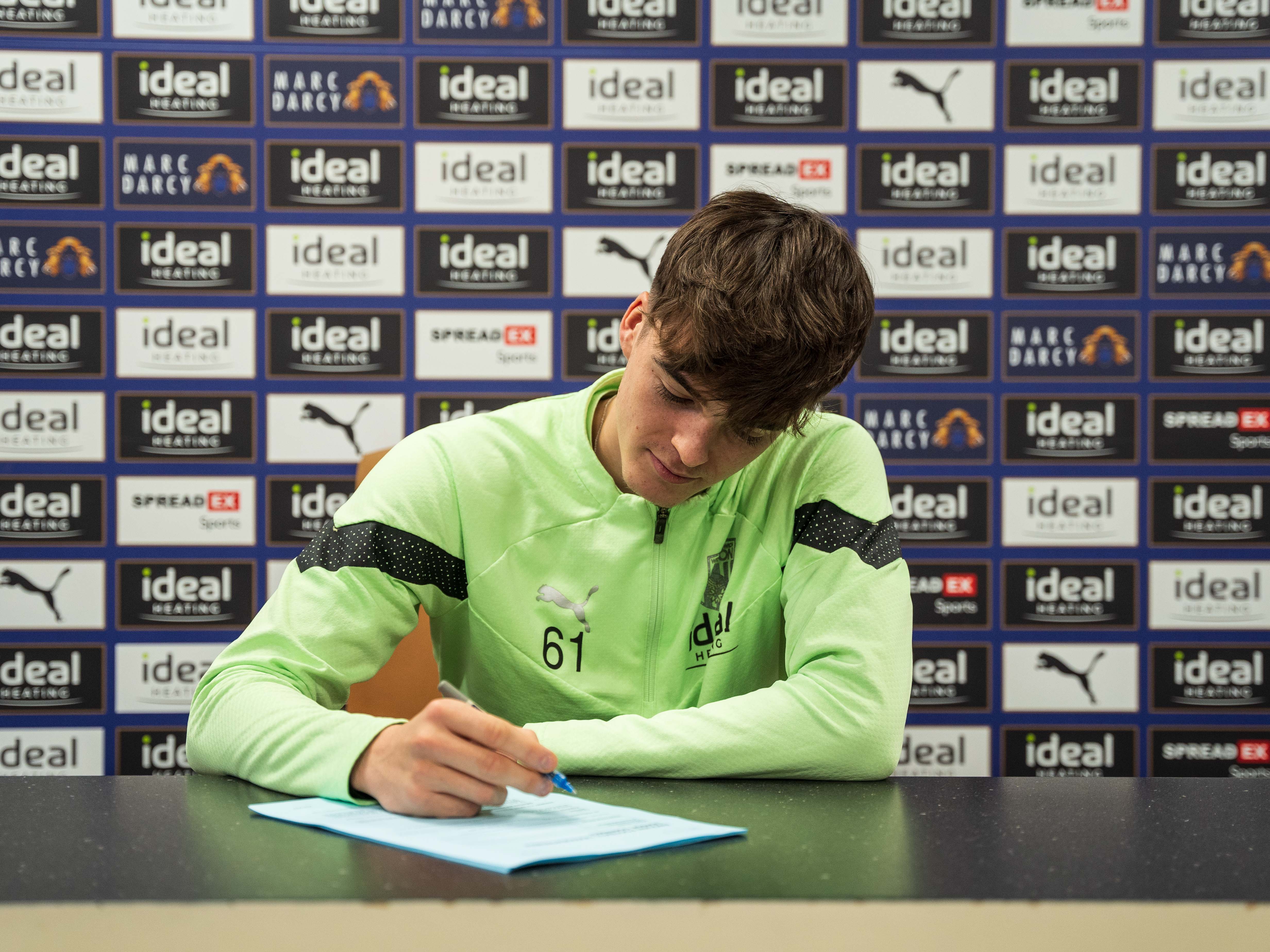Alex Williams signing his first professional contract with Albion