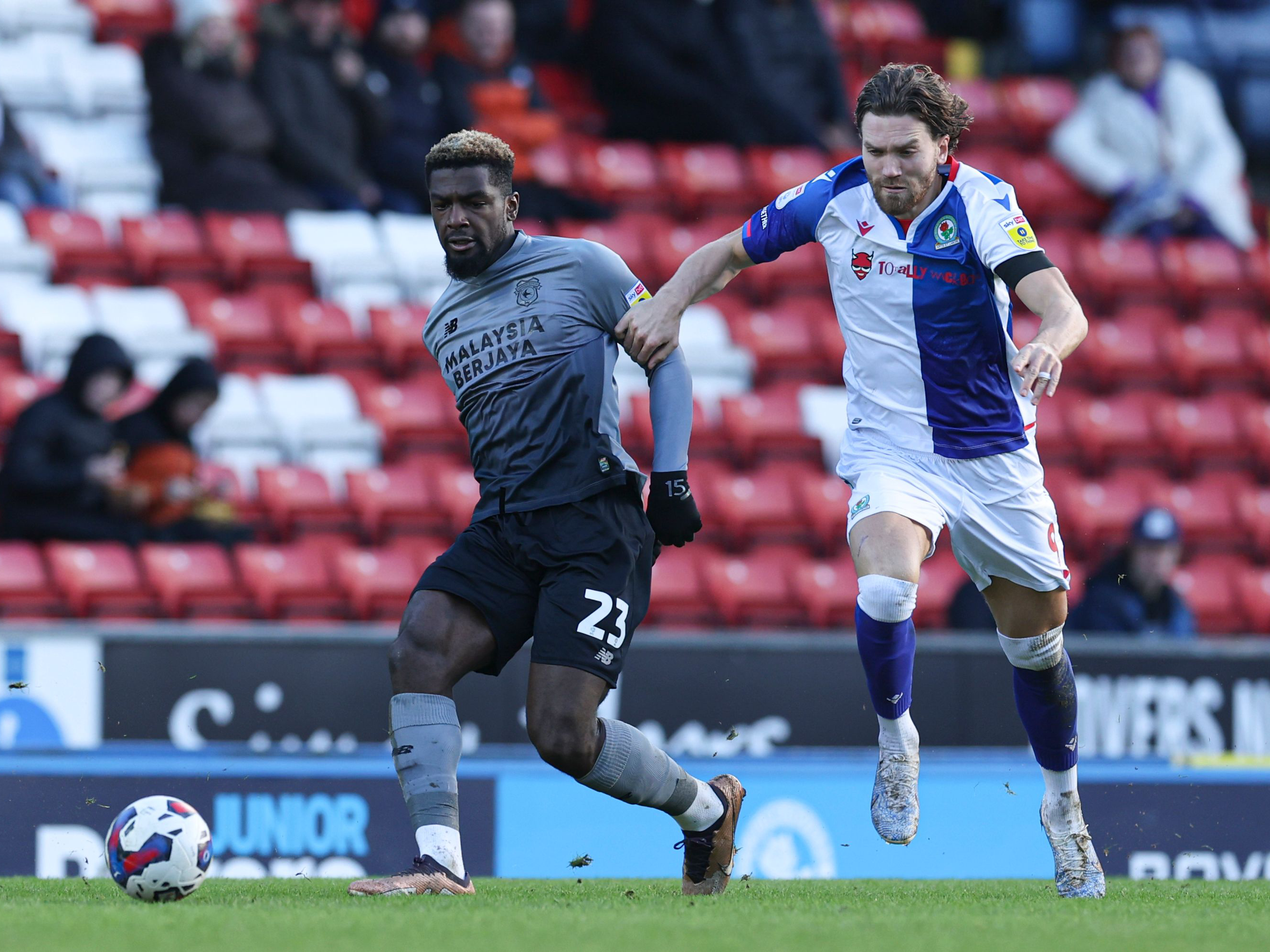 Cedric Kipre battles for the ball with Bradley Dack of Blackburn during his loan side Cardiff City's clash with Rovers at Ewood Park