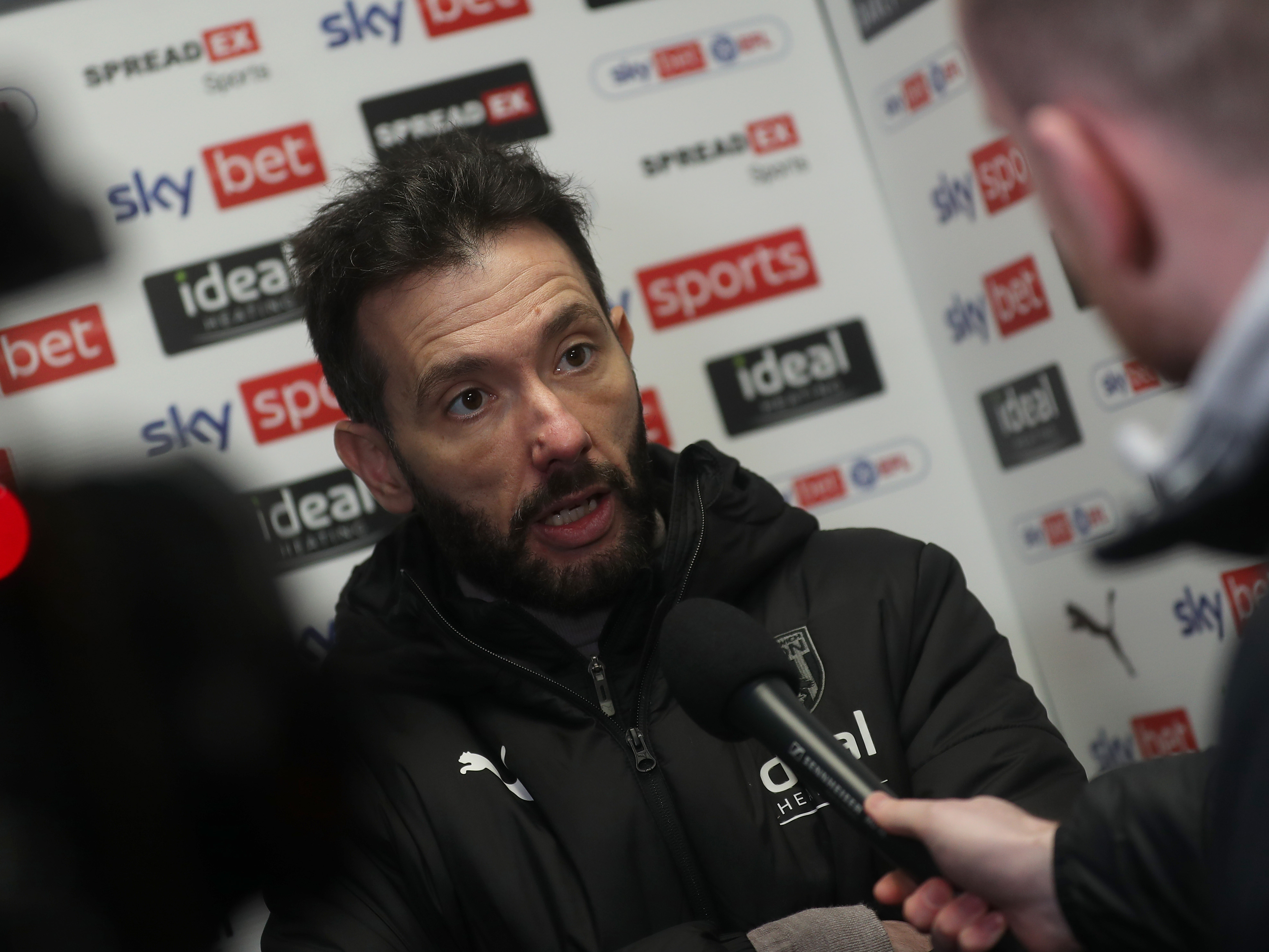 Carlos Corberán is interviewed after Albion's win against Huddersfield