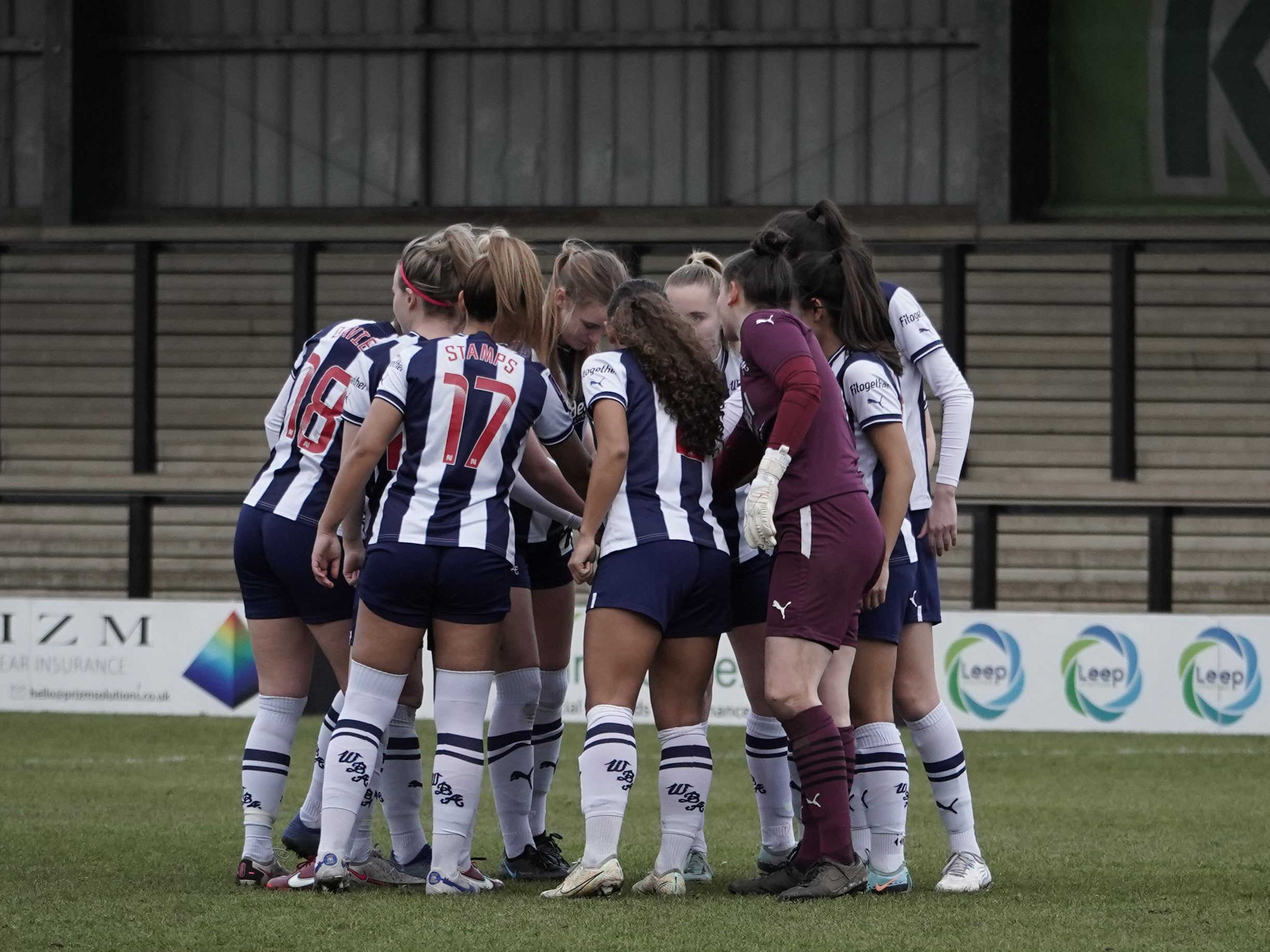 Albion Women team in a huddle