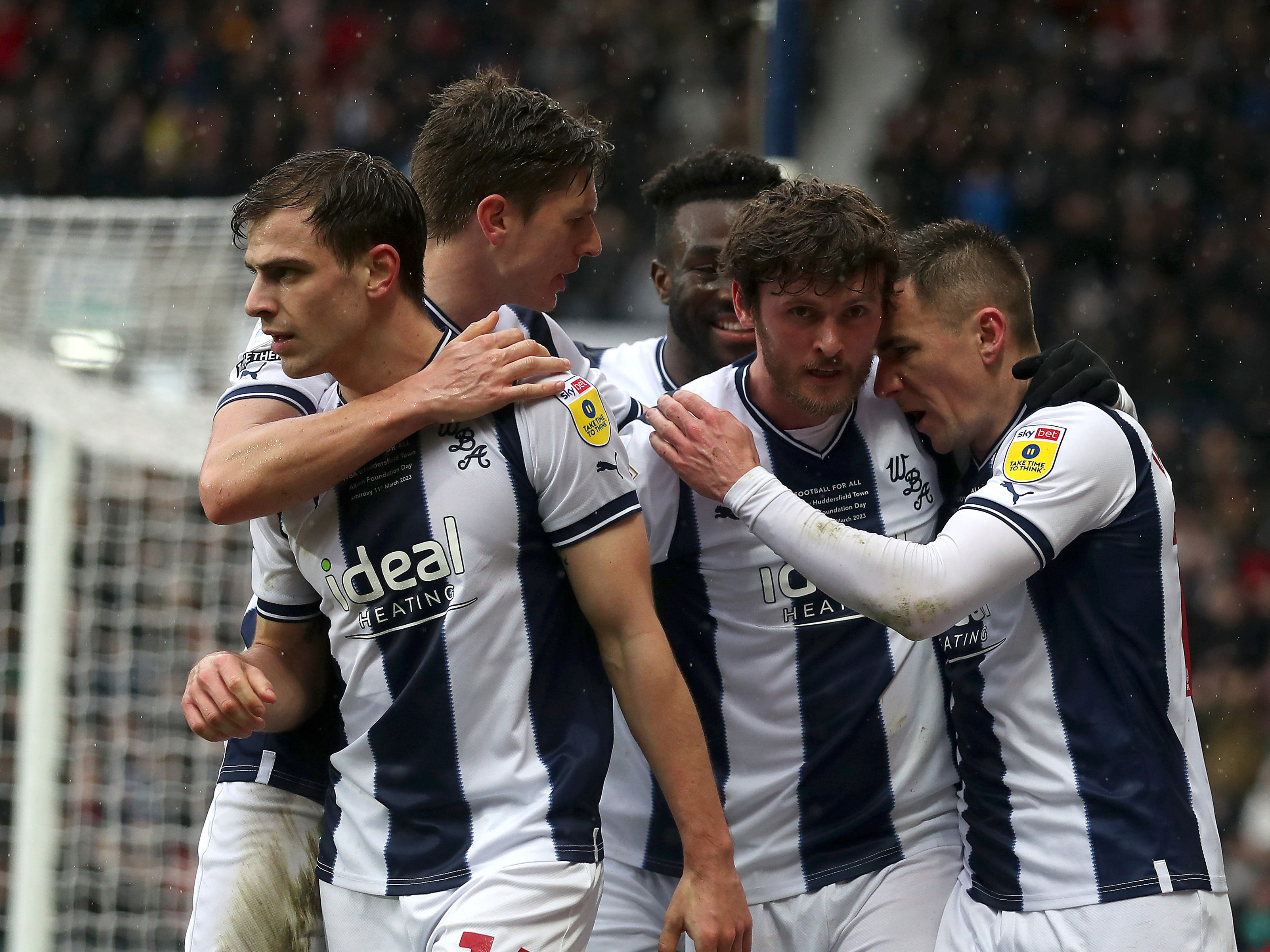 Albion players celebrate after scoring against Huddersfield 