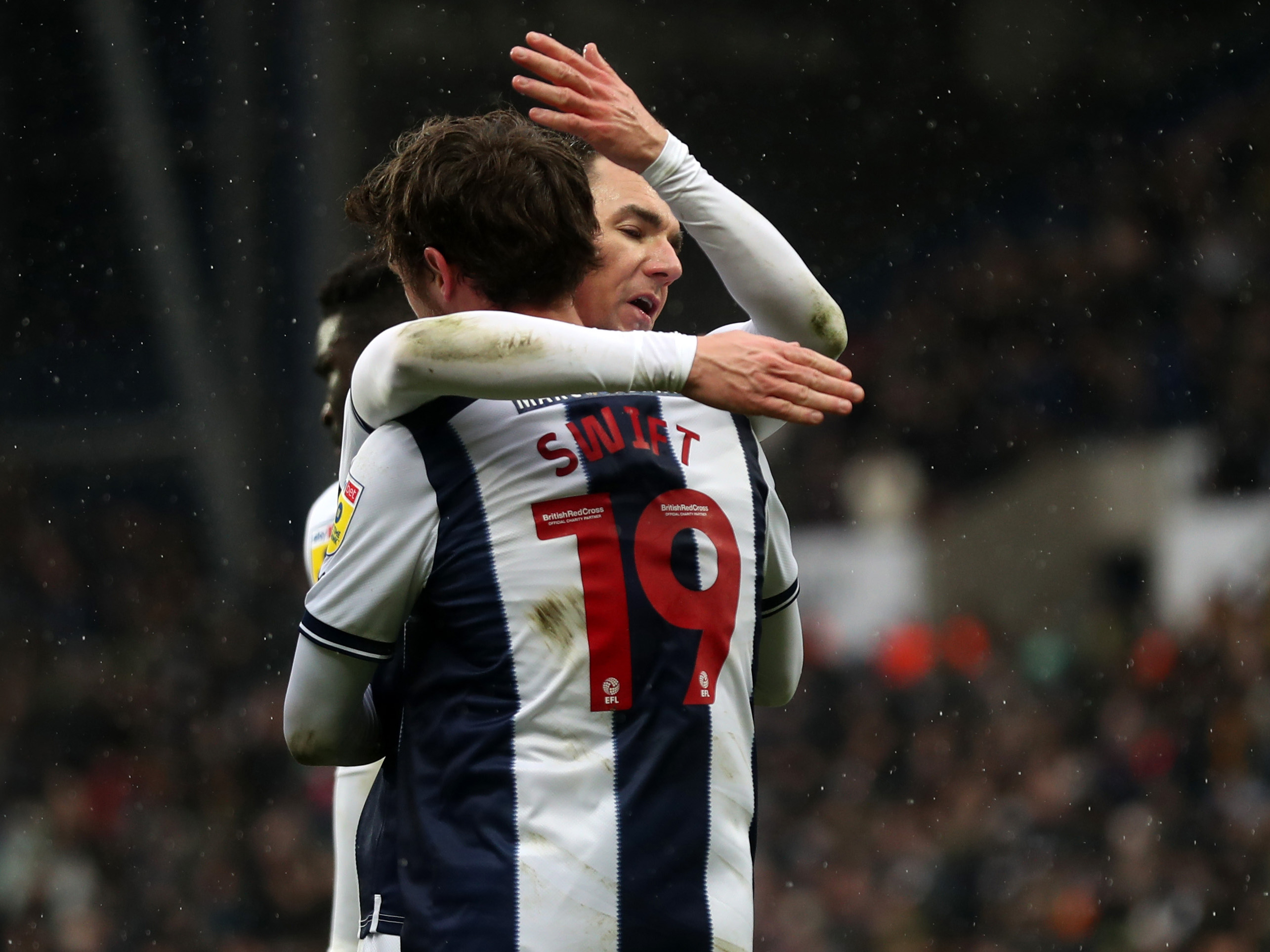 John Swift and Jed Wallace celebrate after Albion's first goal v Huddersfield Town at The Hawthorns