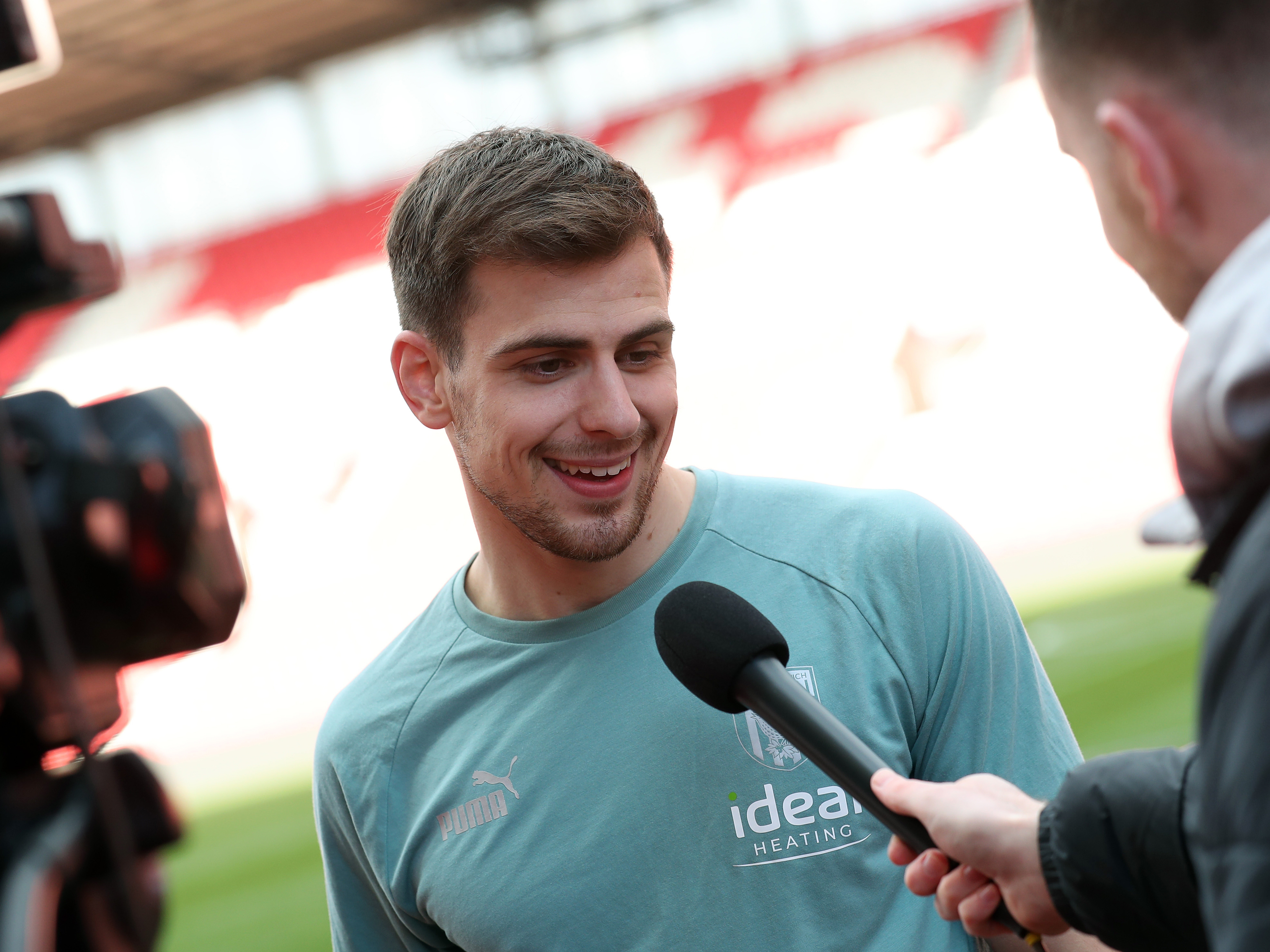 Jayson Molumby is interviewed following Albion's win at Stoke