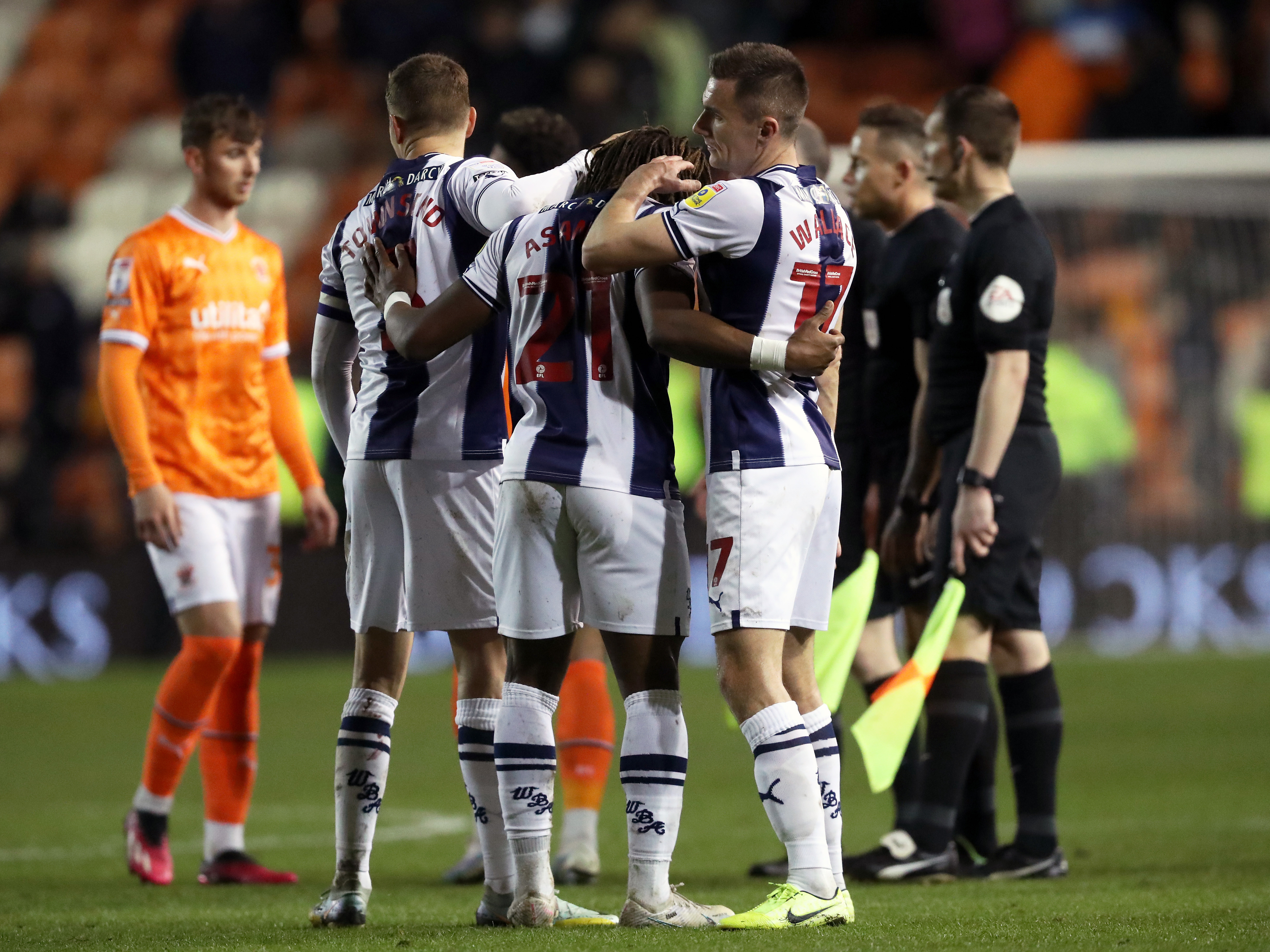 Albion players celebrate together at full time at Blackpool