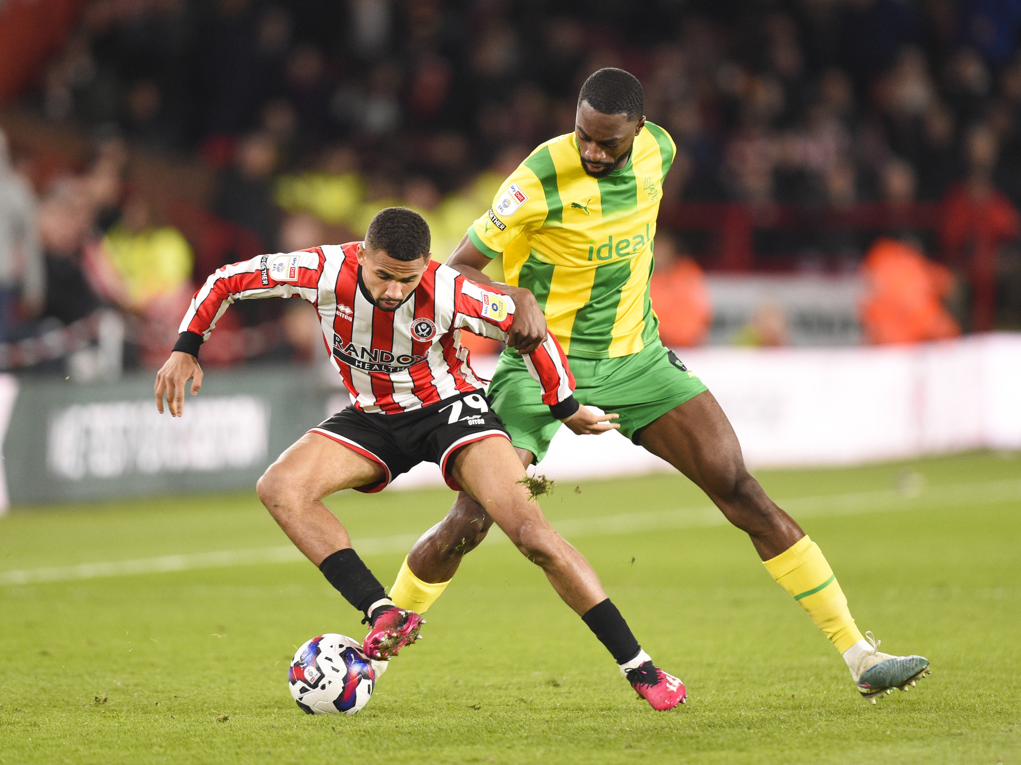 An image of Semi Ajayi battling for the ball against a Sheffield United player