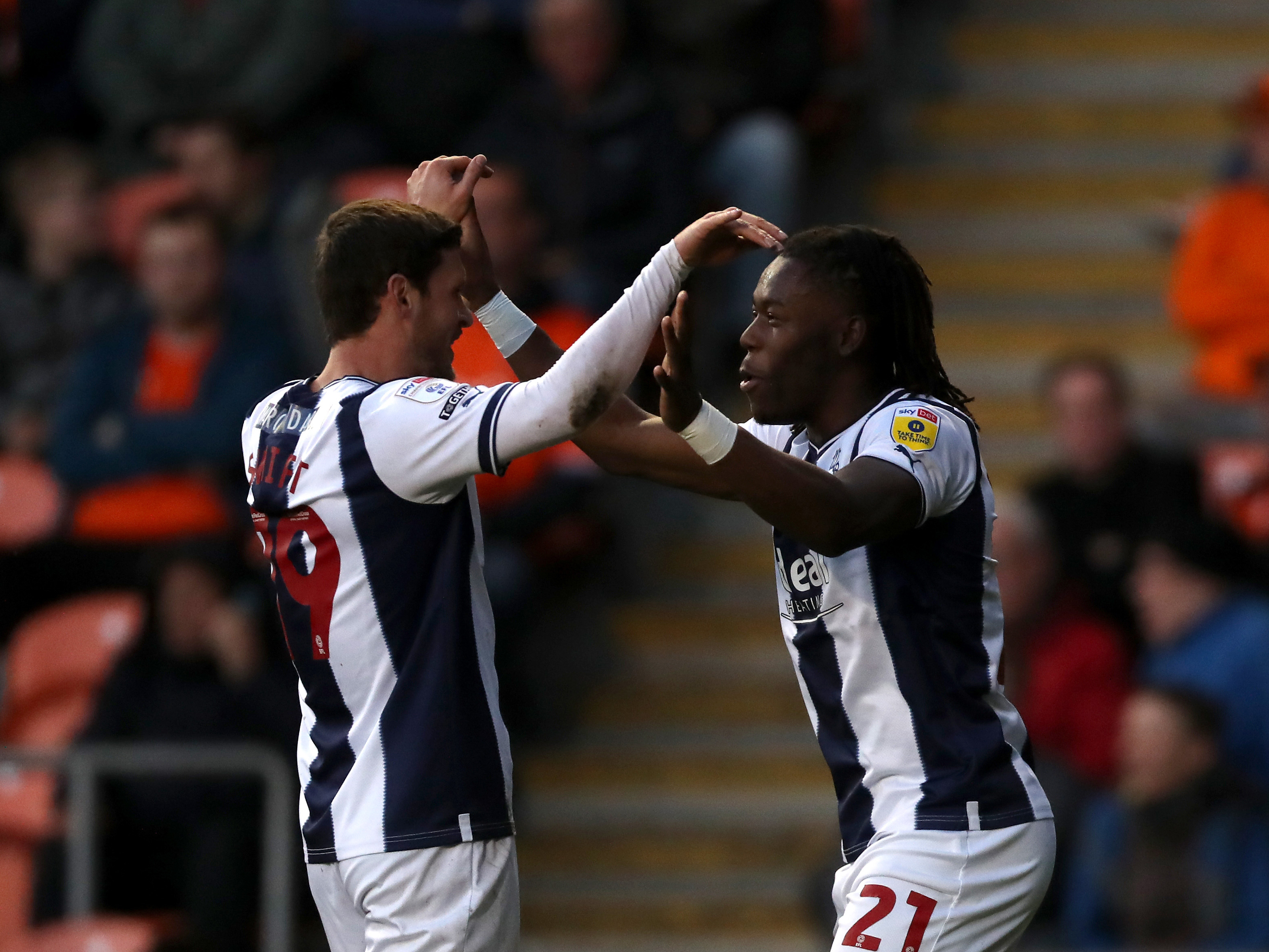 An image of John Swift and Brandon Thomas-Asante celebrating a goal against Blackpool