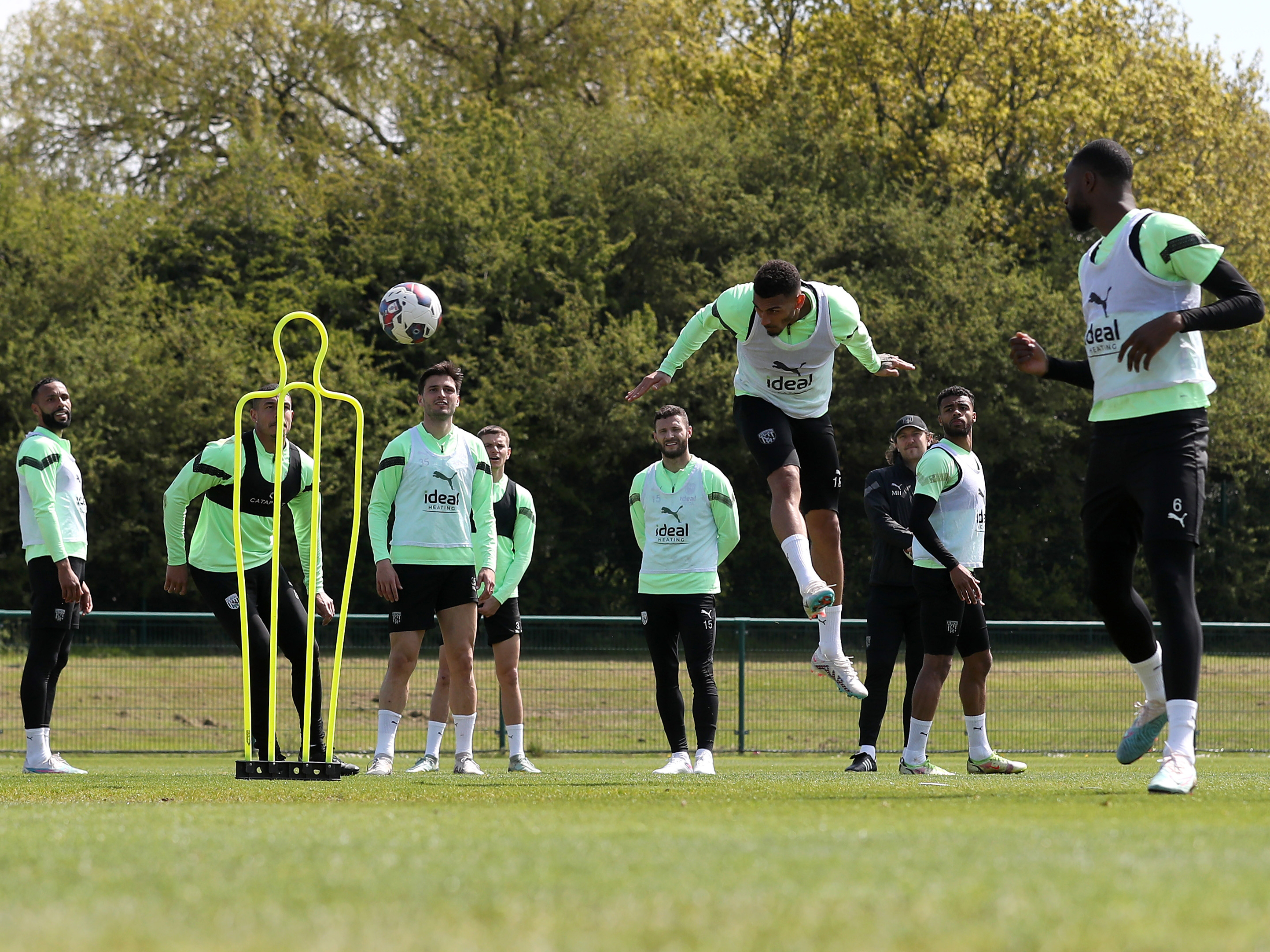 Karlan Grant heading the ball in training 