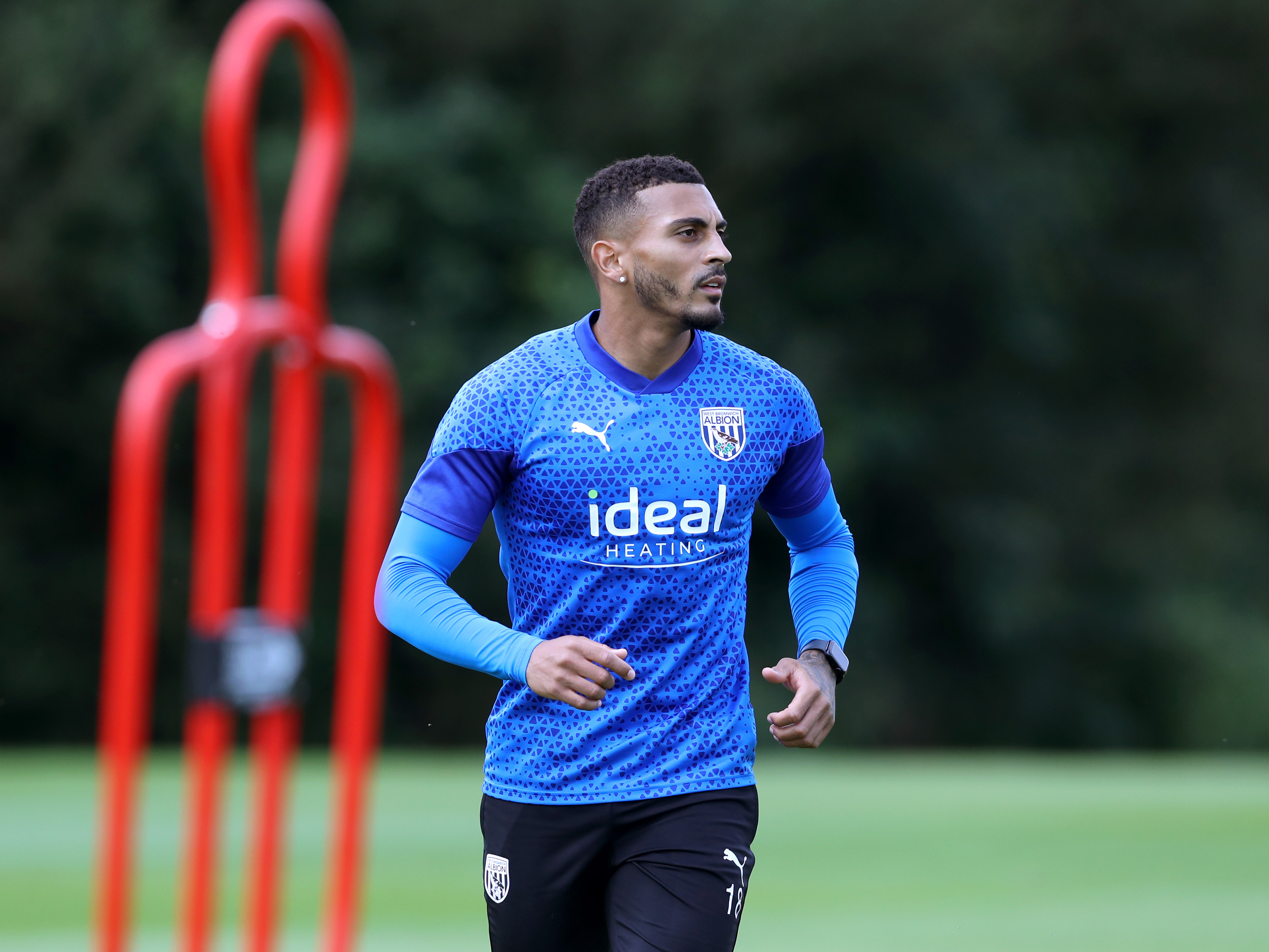 An image of Karlan Grant in training