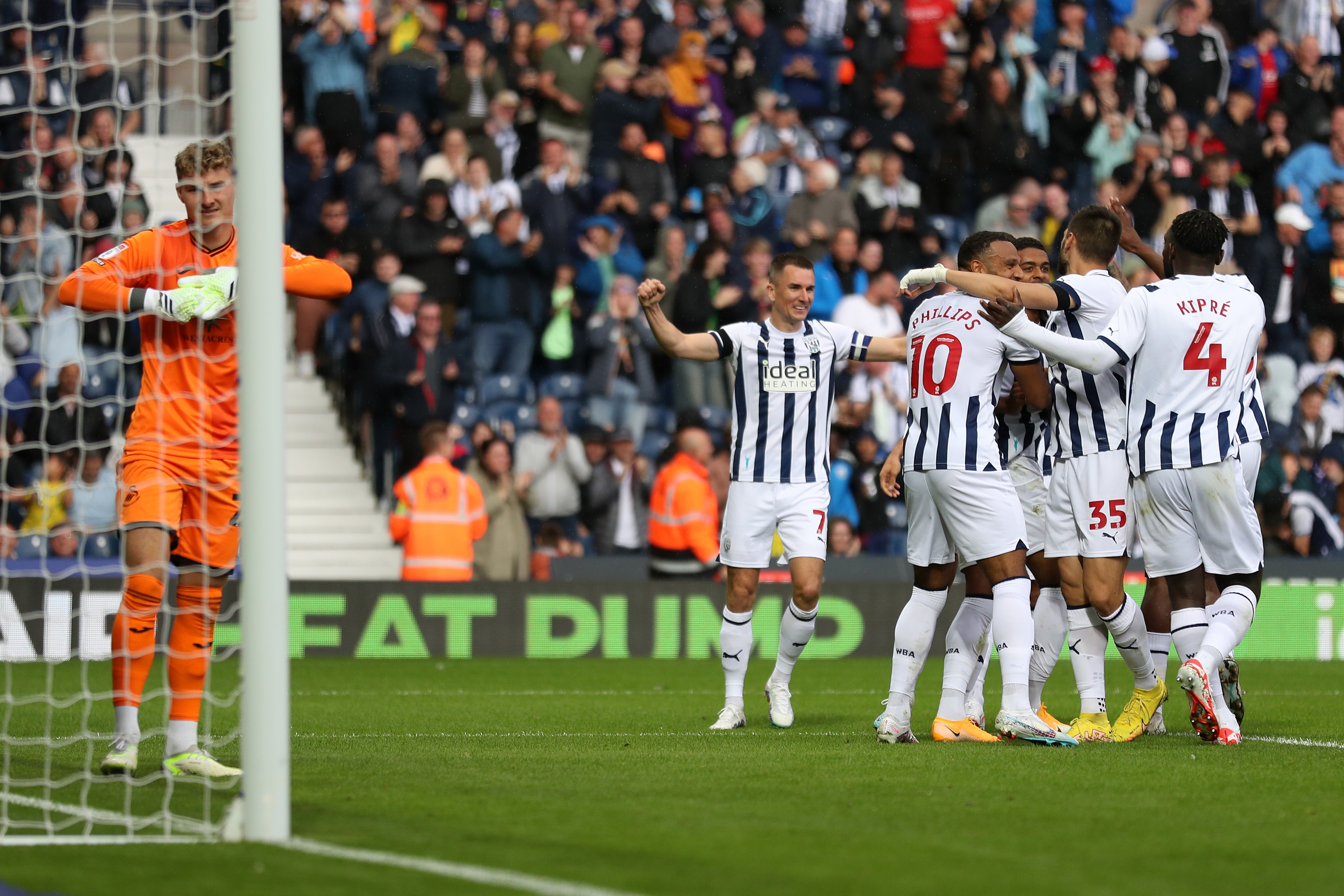 Albion players celebrate their second goal against Swansea 