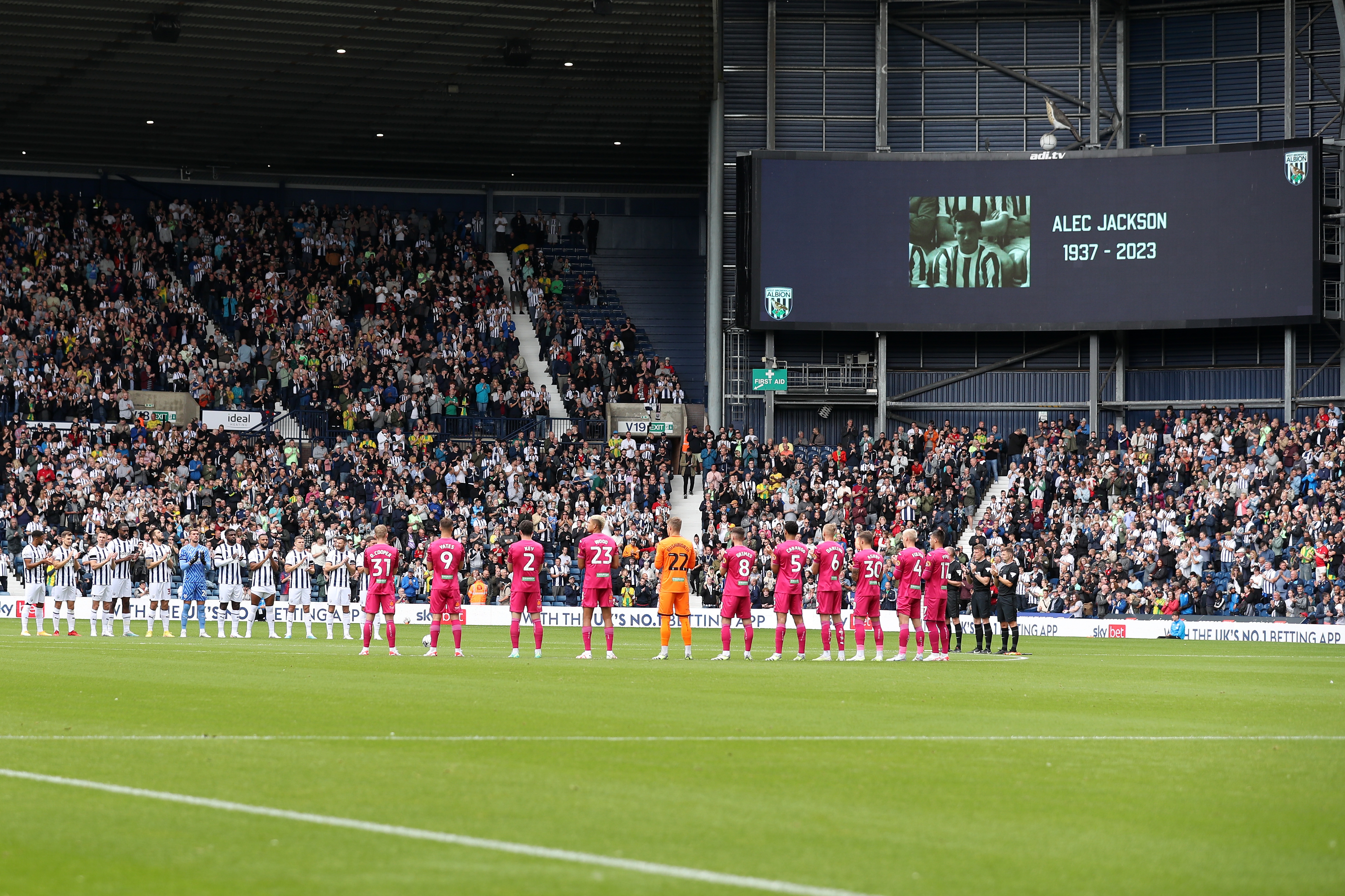 Albion and Swansea players applaud Alec Jackson during a minute's applause at The Hawthorns 