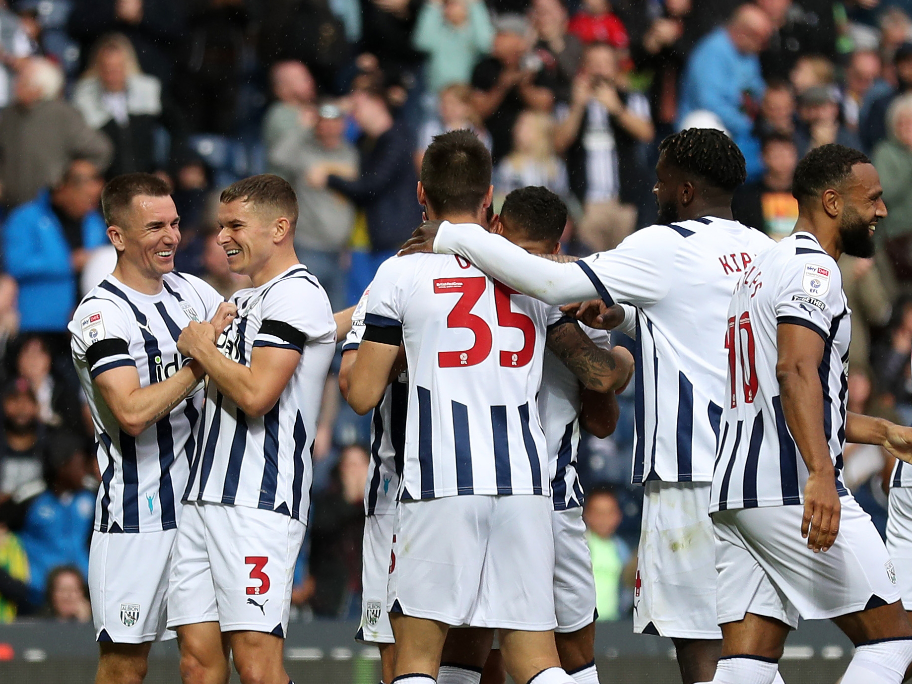 Albion players celebrate after scoring a third goal against Swansea 