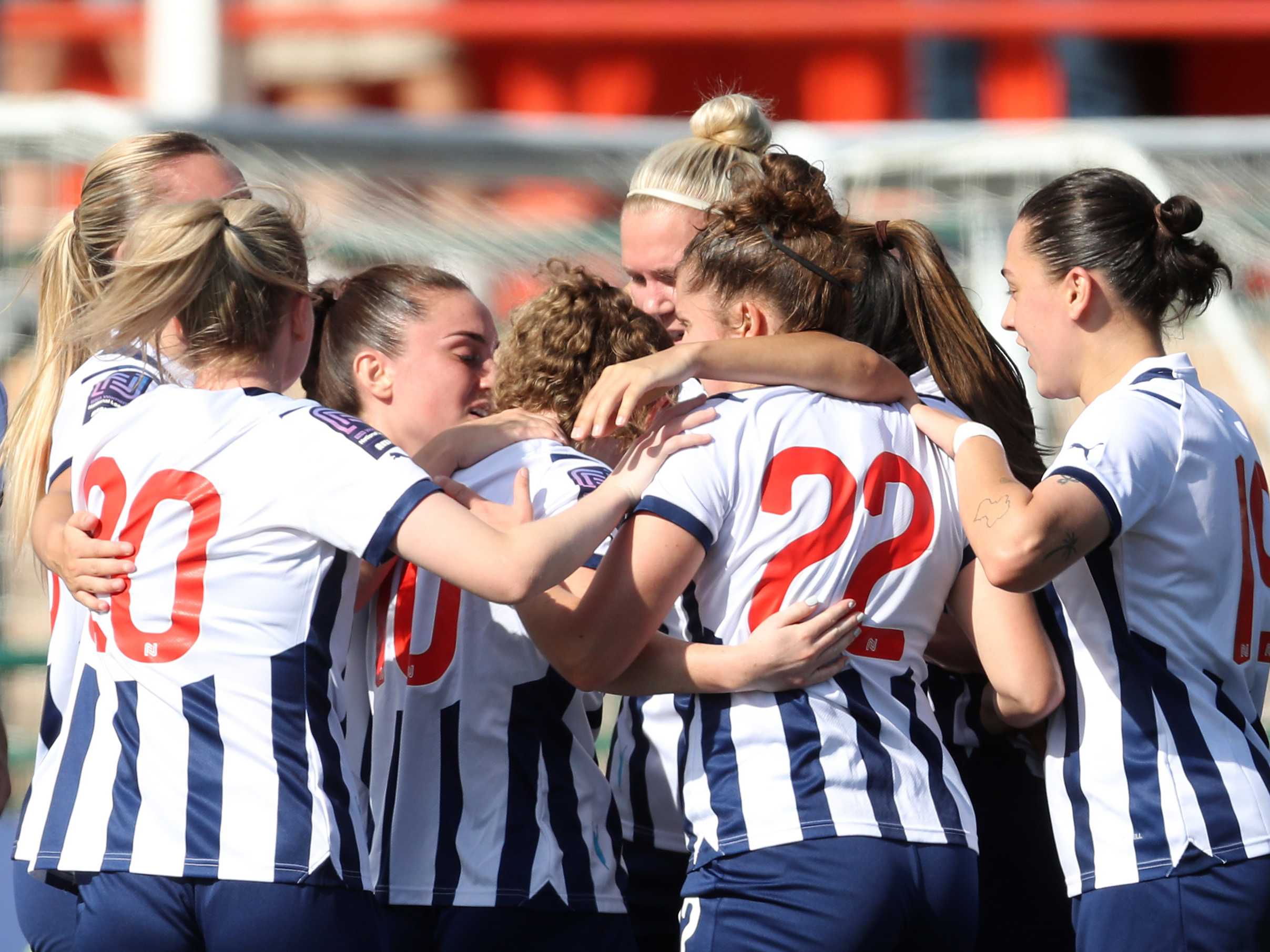 An image of the Albion Women team celebrating a goal