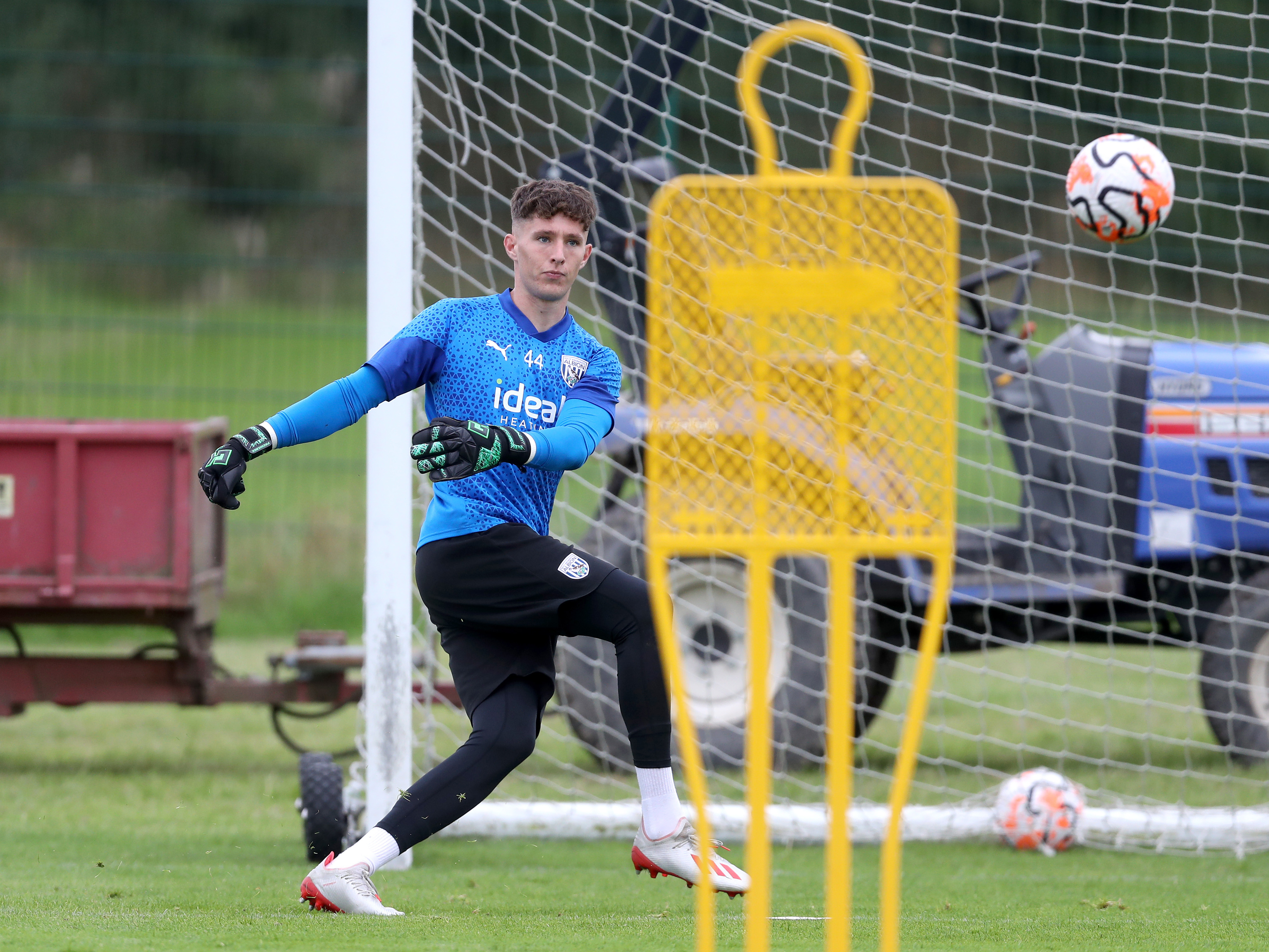 A photo of Albion PL2 goalkeeper Ronnie Hollingshead kicking a ball in training