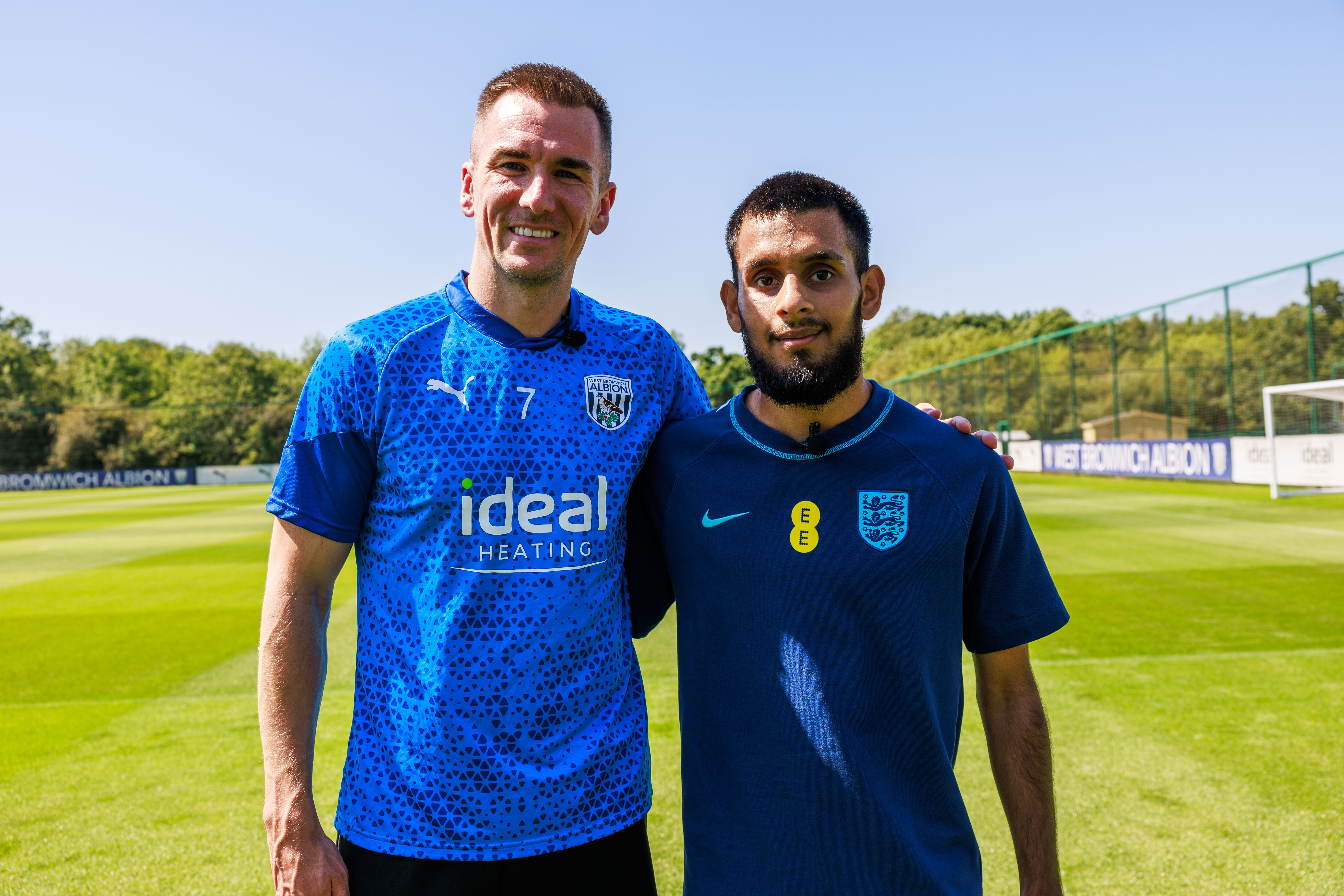 Jed Wallace in WBA training kit with Eesa Amjid in England training kit