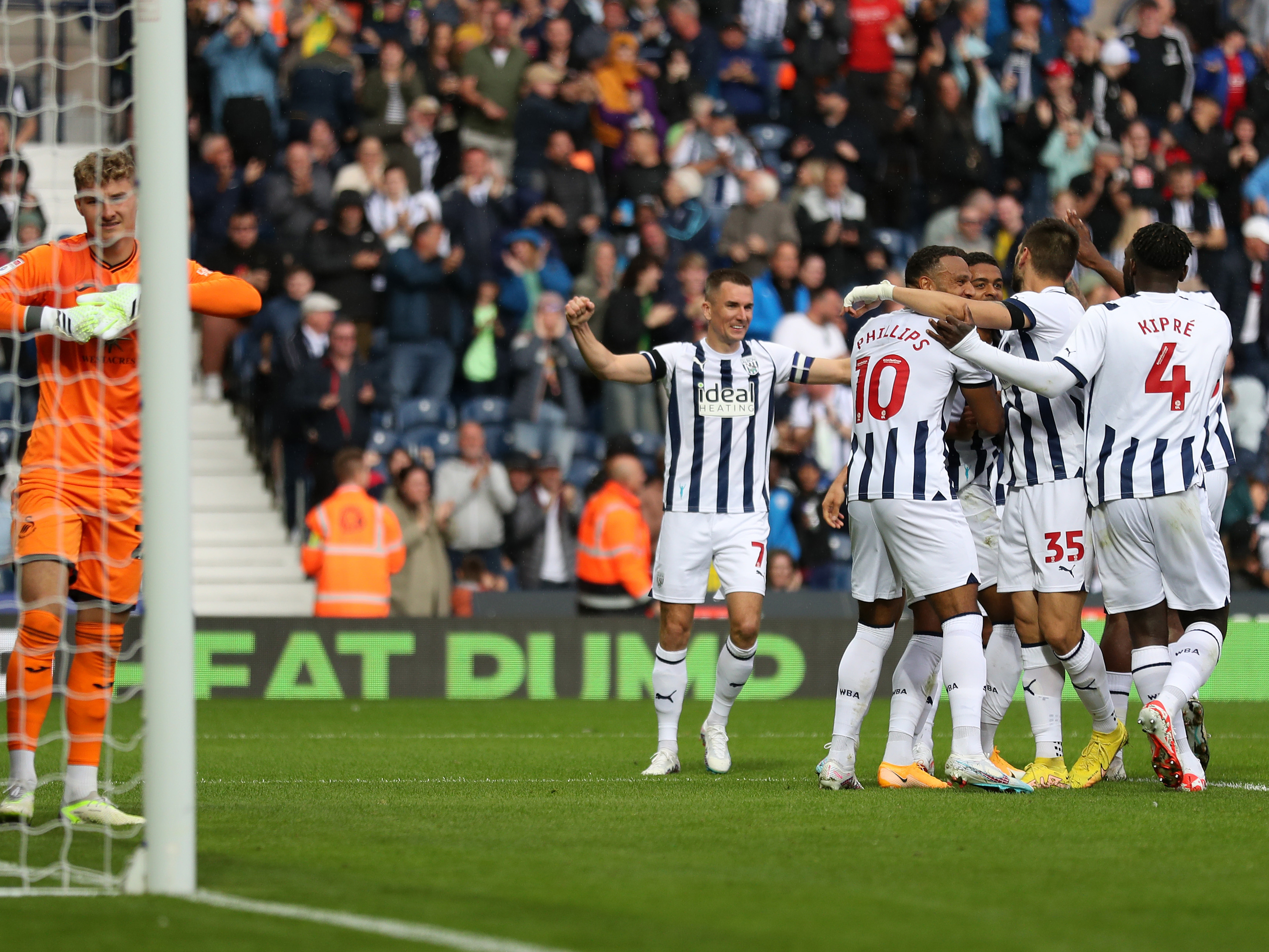 Albion's players celebrate Swift's goal against Swansea