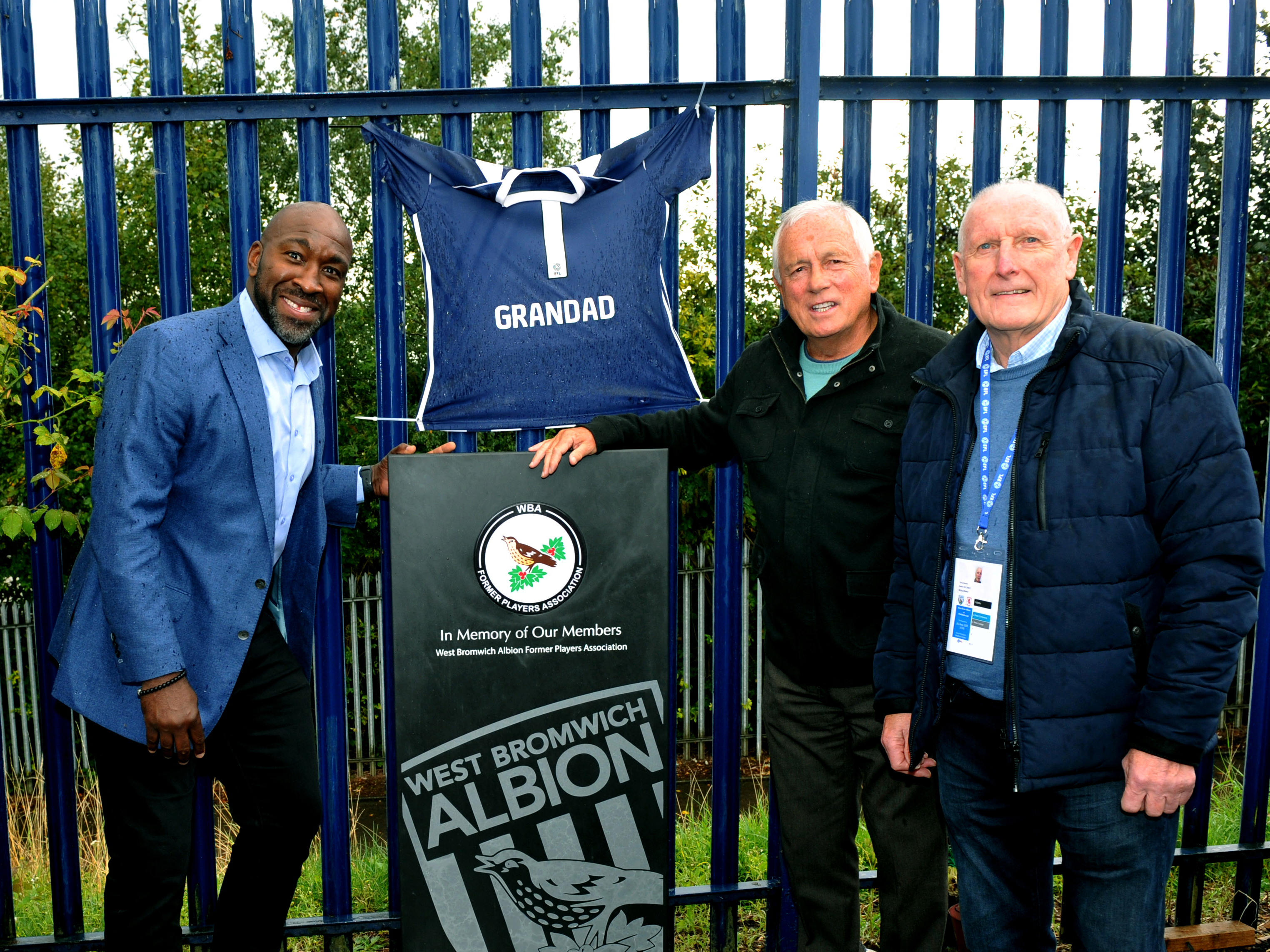 Darren Moore, Ray Wilson and Tony Brown standing next to the memorial slate at The Hawthorns