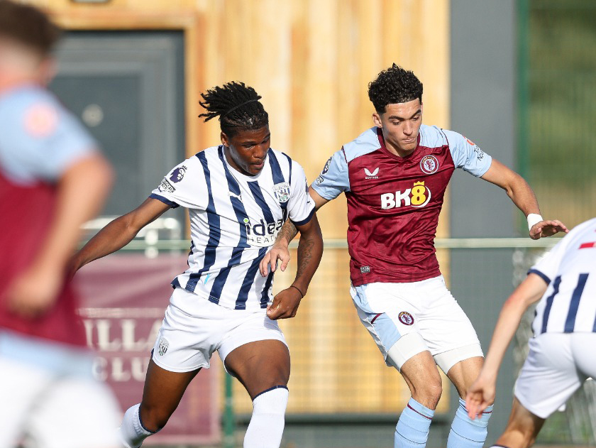 Aaron Harper-Bailey fights for the ball with an Aston Villa player