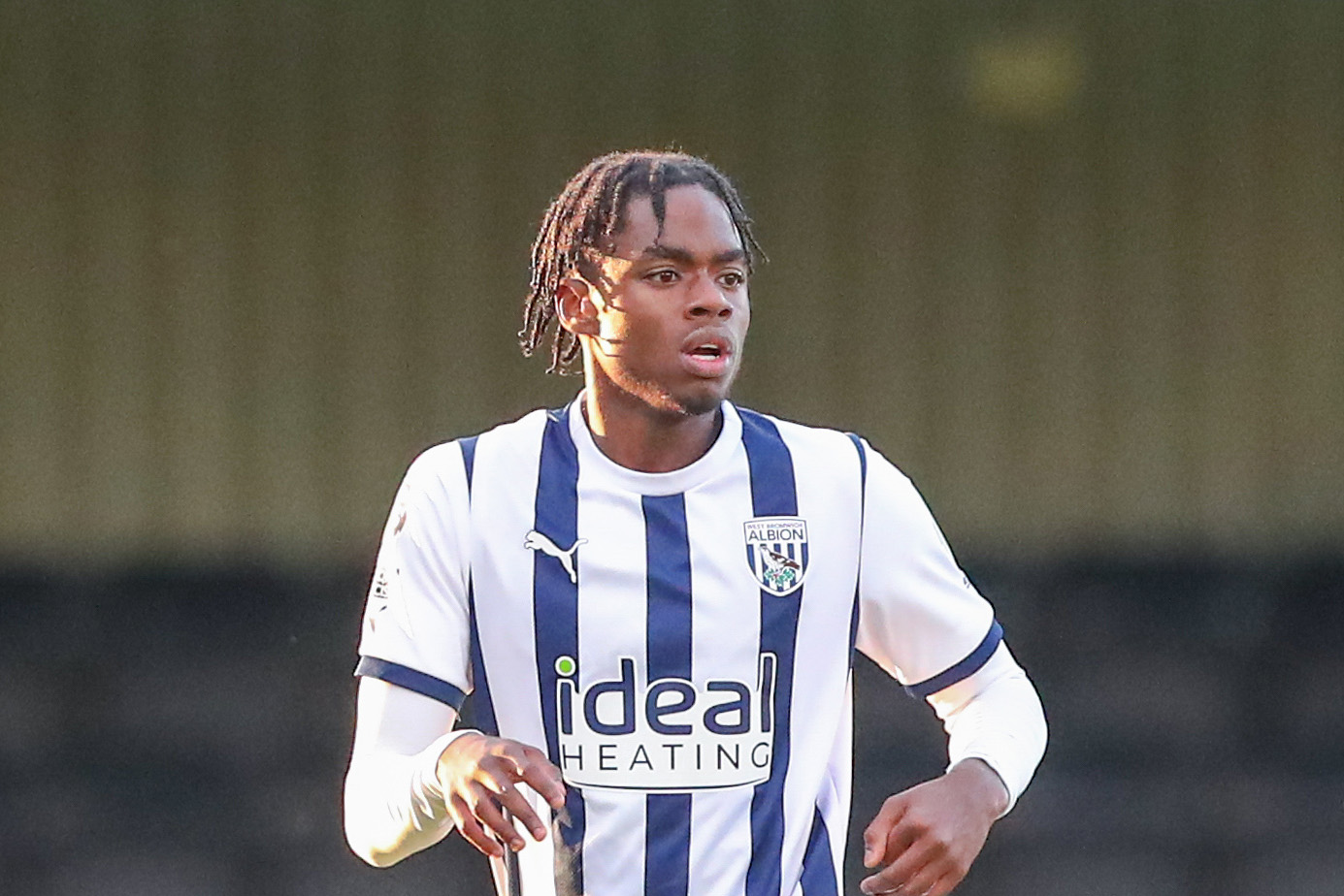Akeel Higgins wearing the Albion home shirt in PL2 action