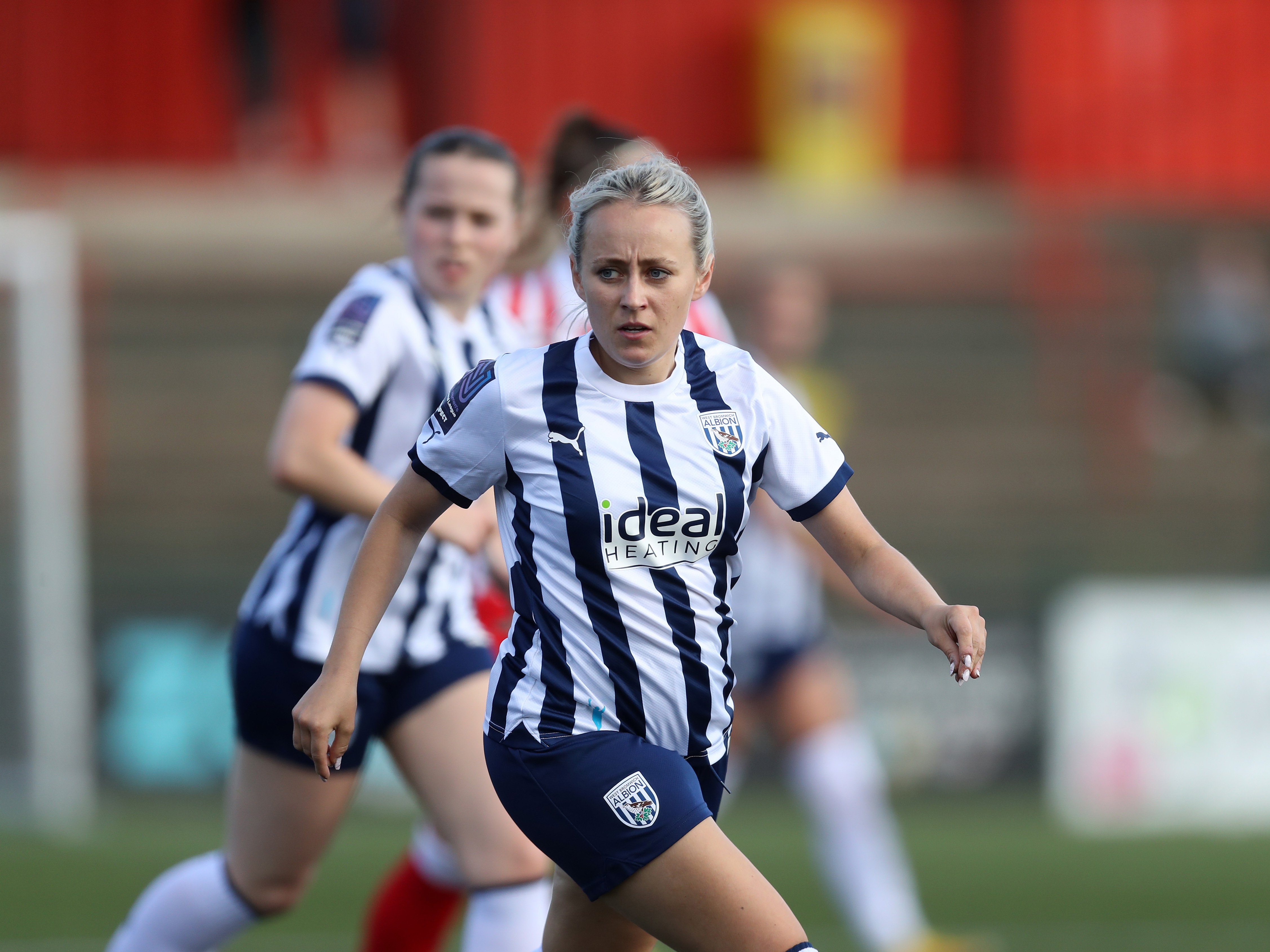 Kerry Walklett in action in the home kit for Albion Women 