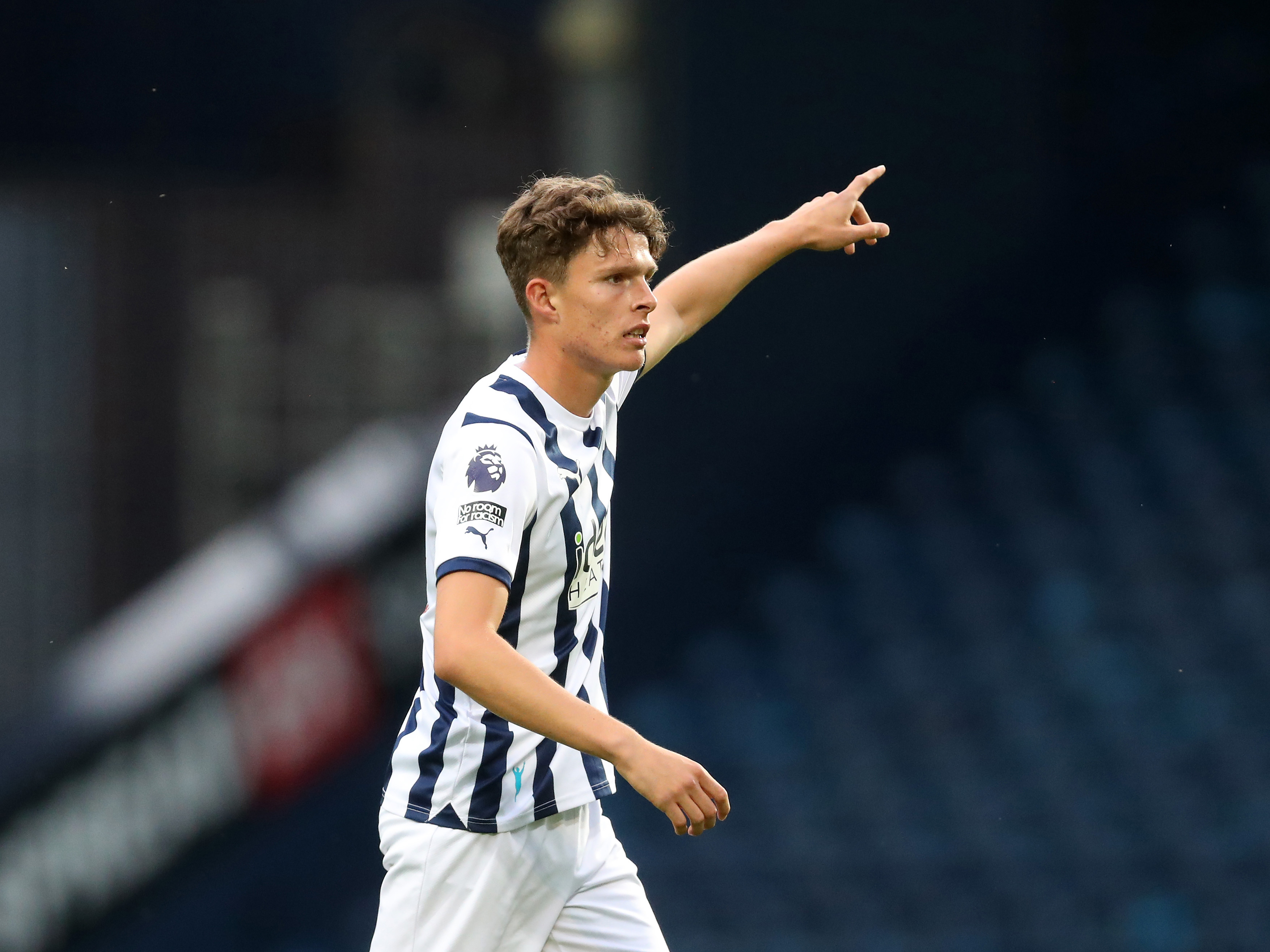 A photo of Matthew Richards pointing directions during Albion's Premier League 2 game against Blackburn at The Hawthorns